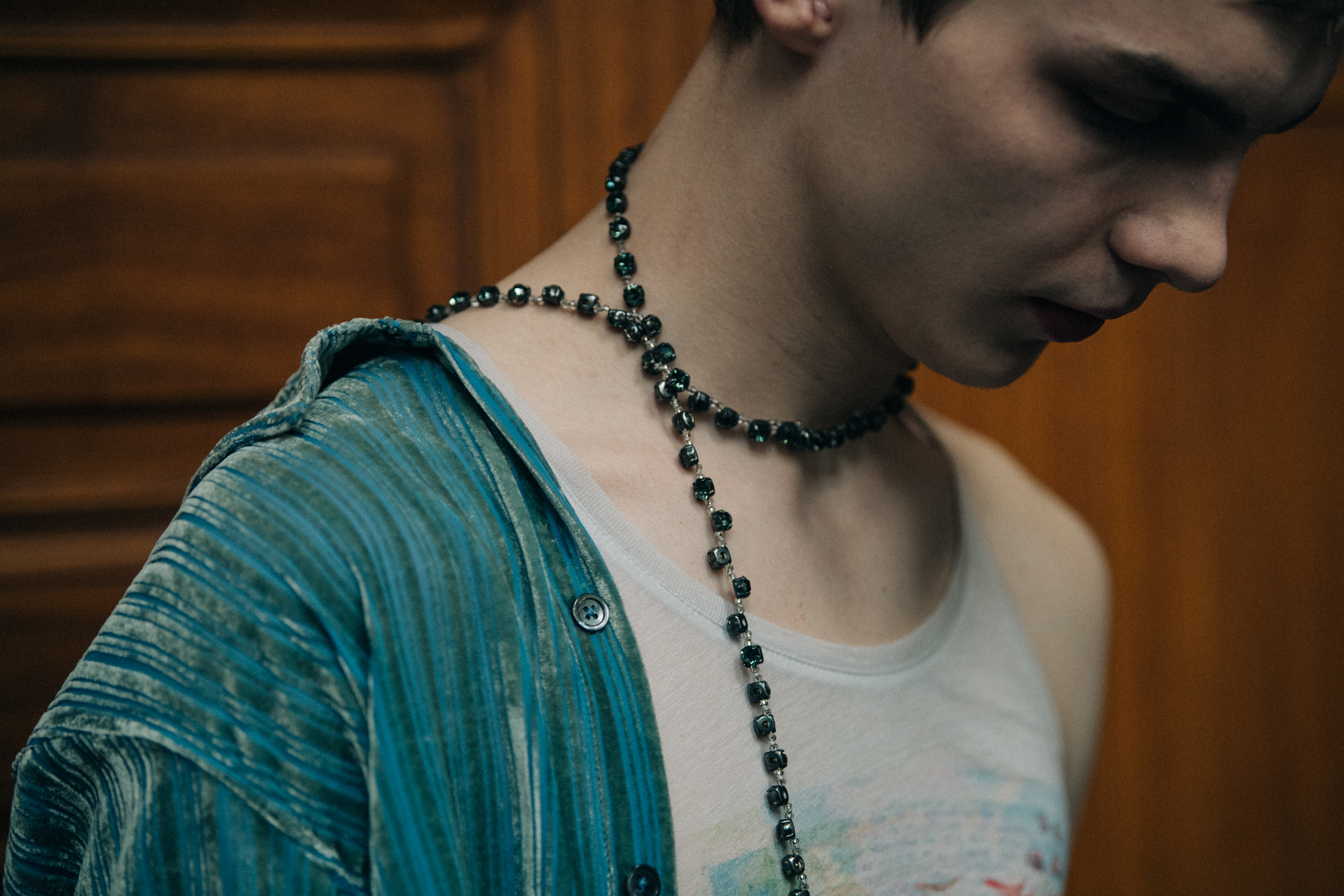 Model wearing necklace backstage