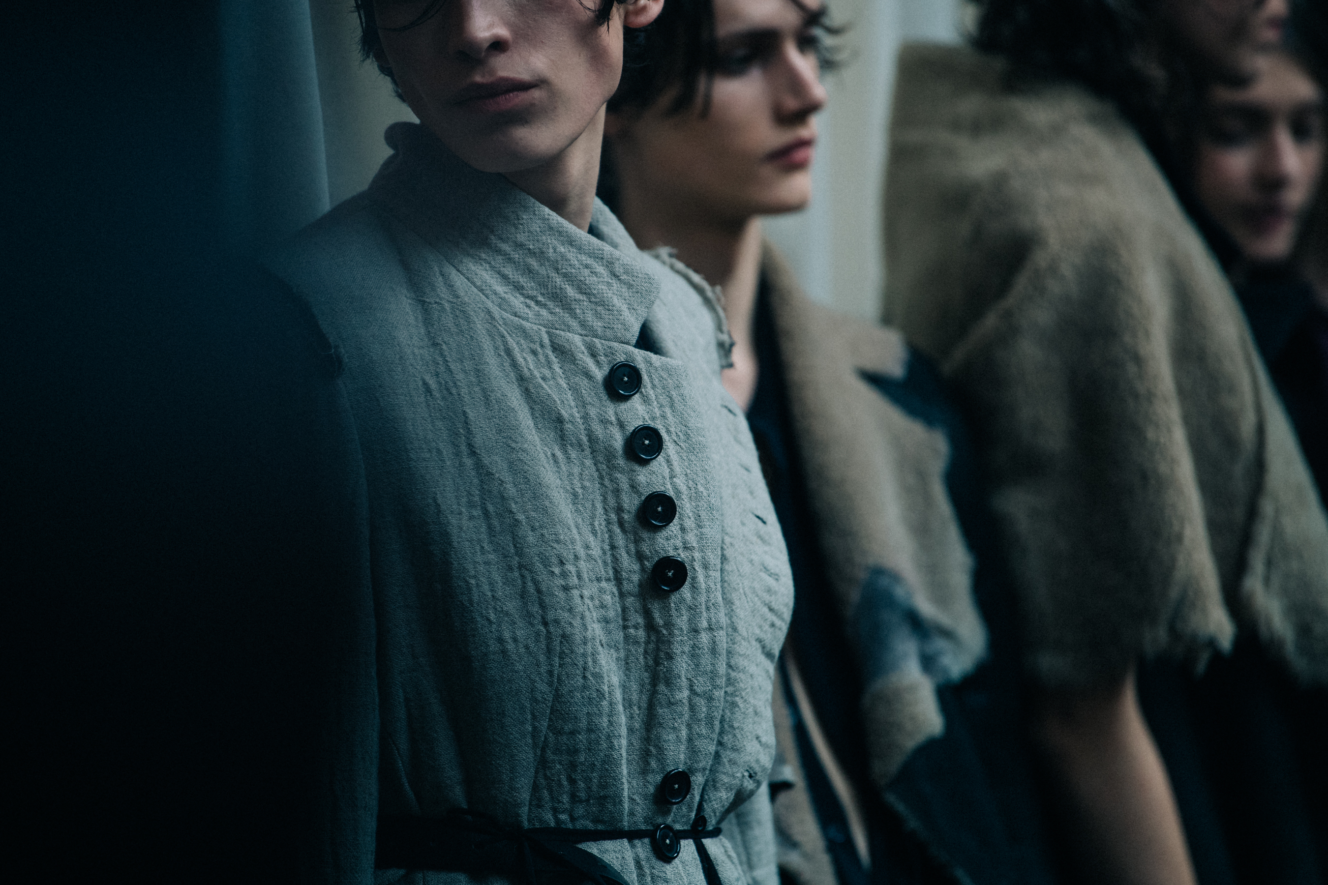 Models wearing grey outfits