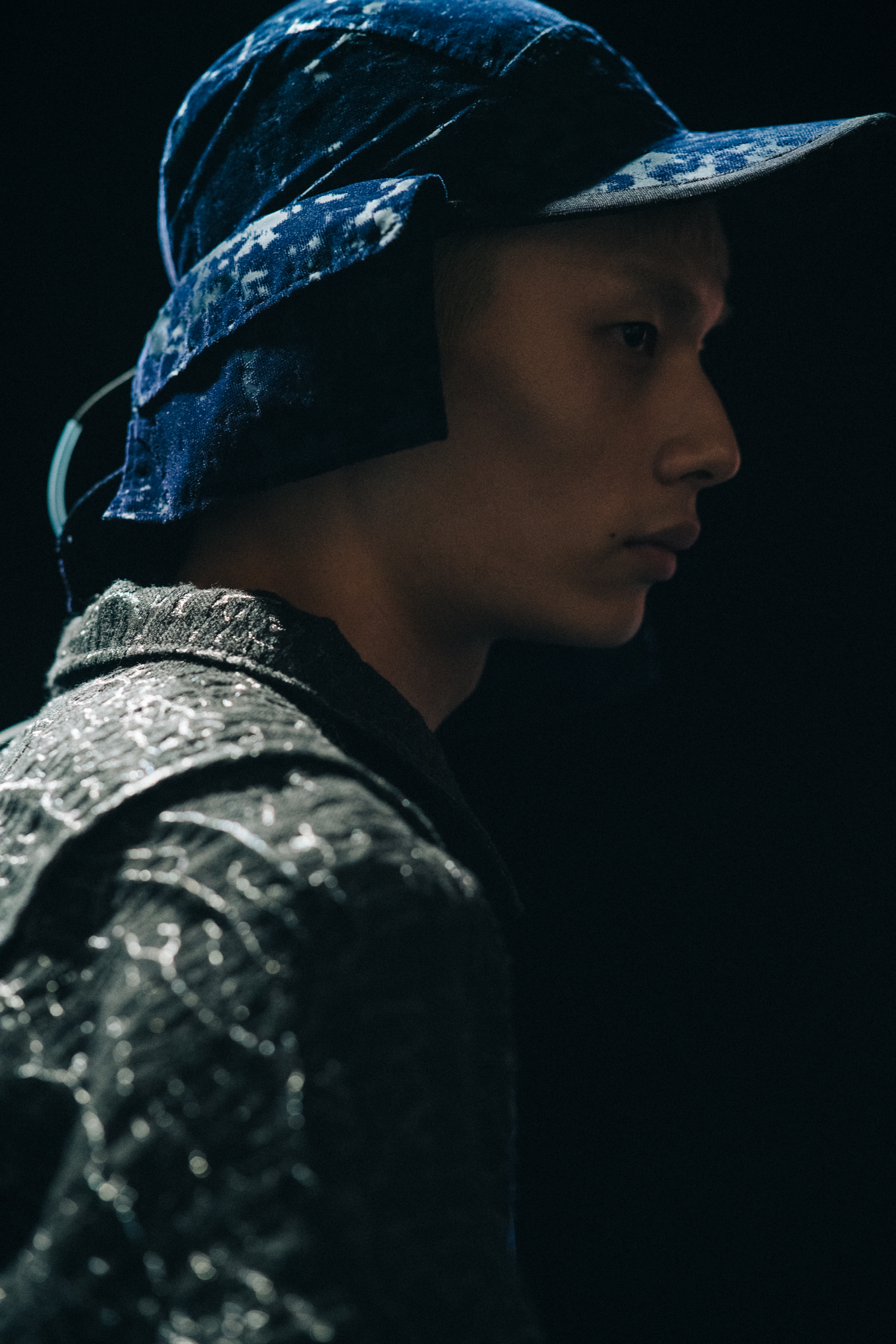 Model wearing blue wool cap and jacket