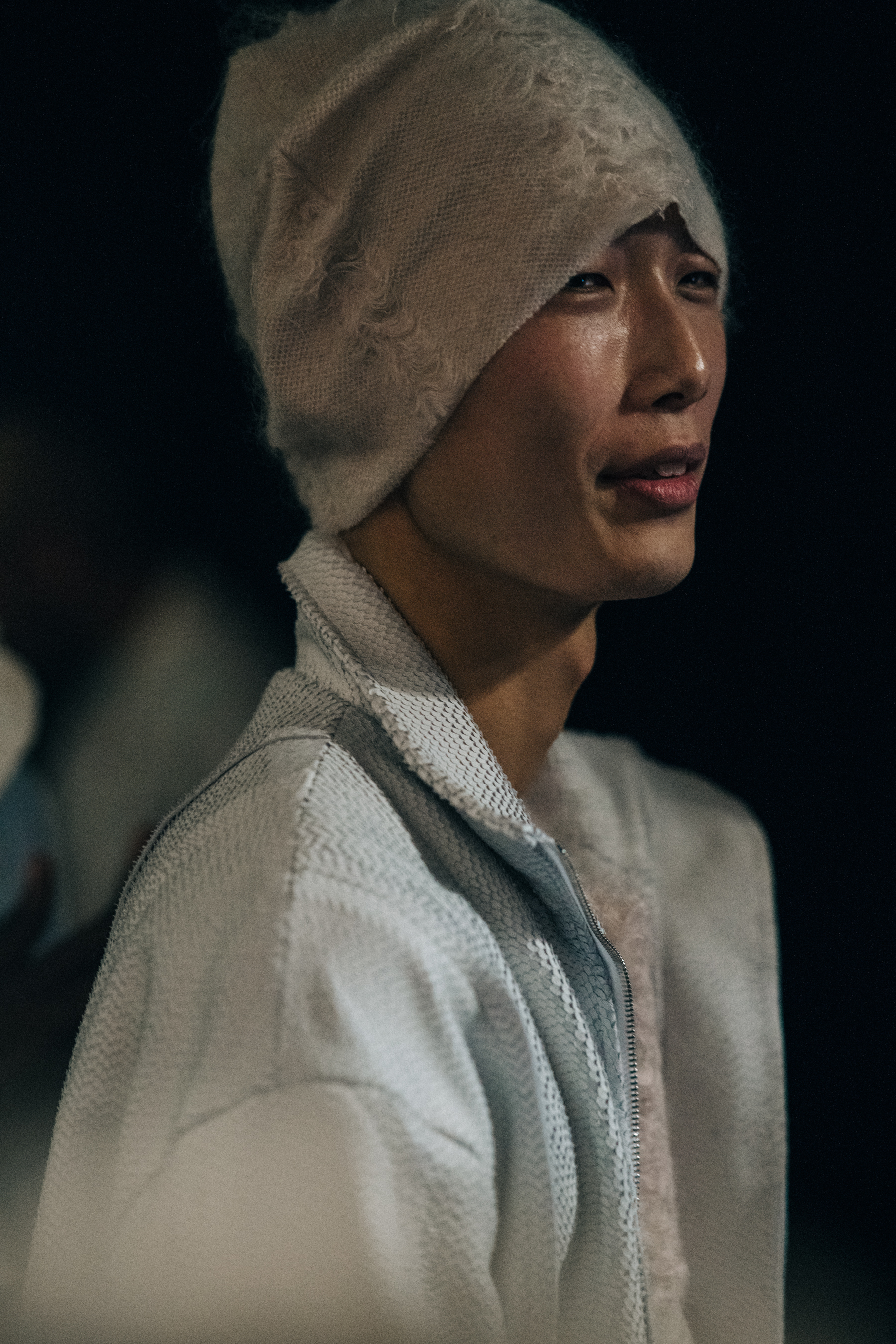 Model wearing pale wool outfit with hat