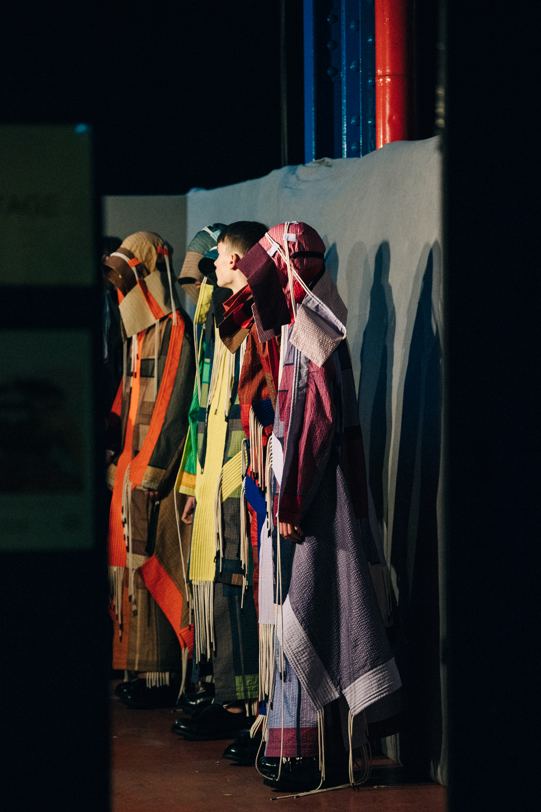 Models wearing colourful Craig Green outfits
