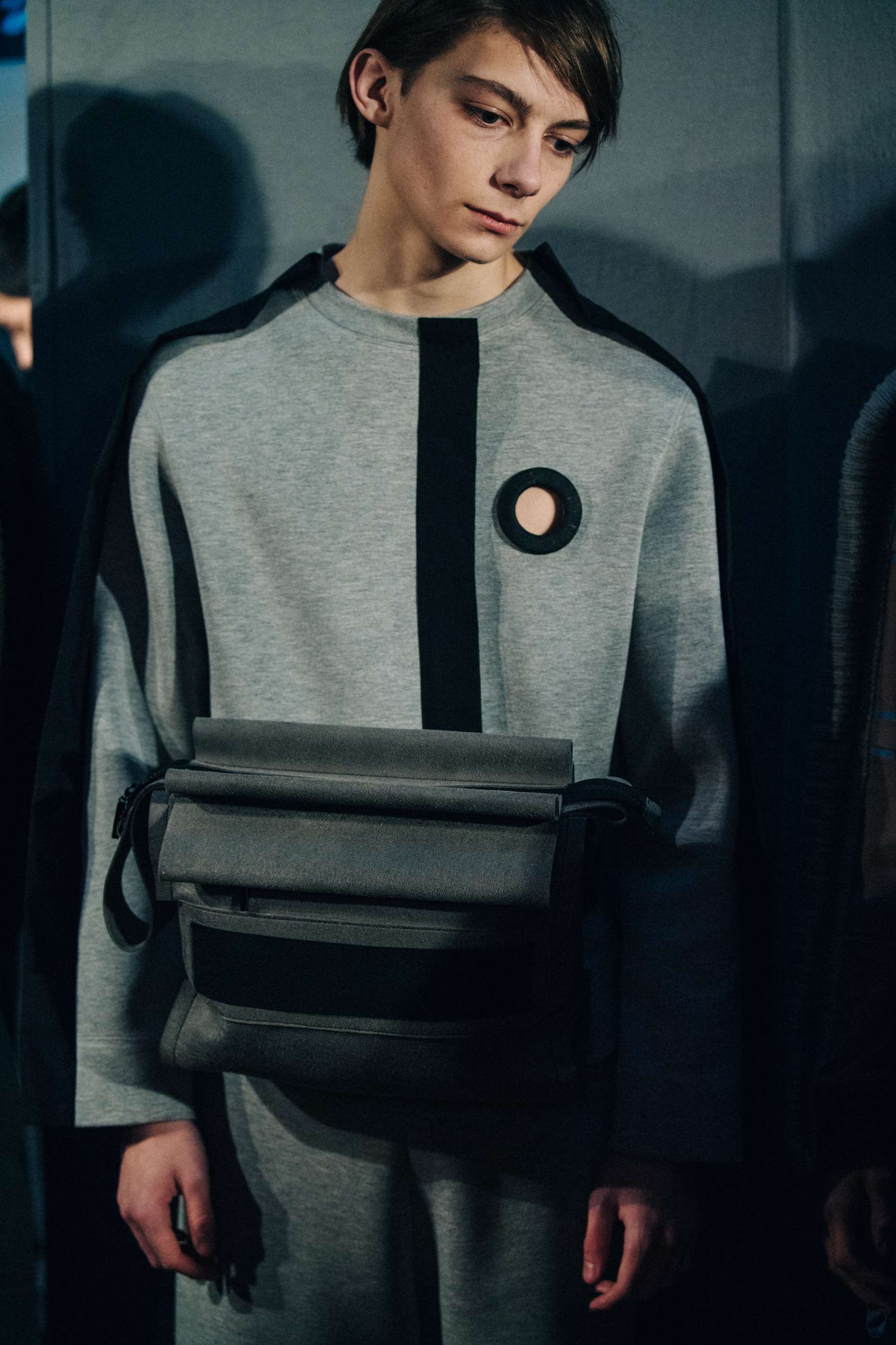 Model wearing grey backstage