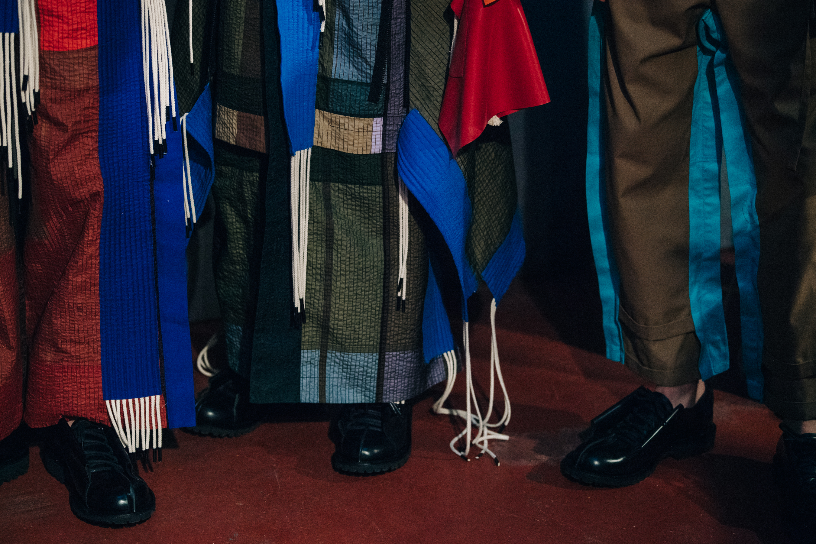Models wearing colourful Craig Green outfits