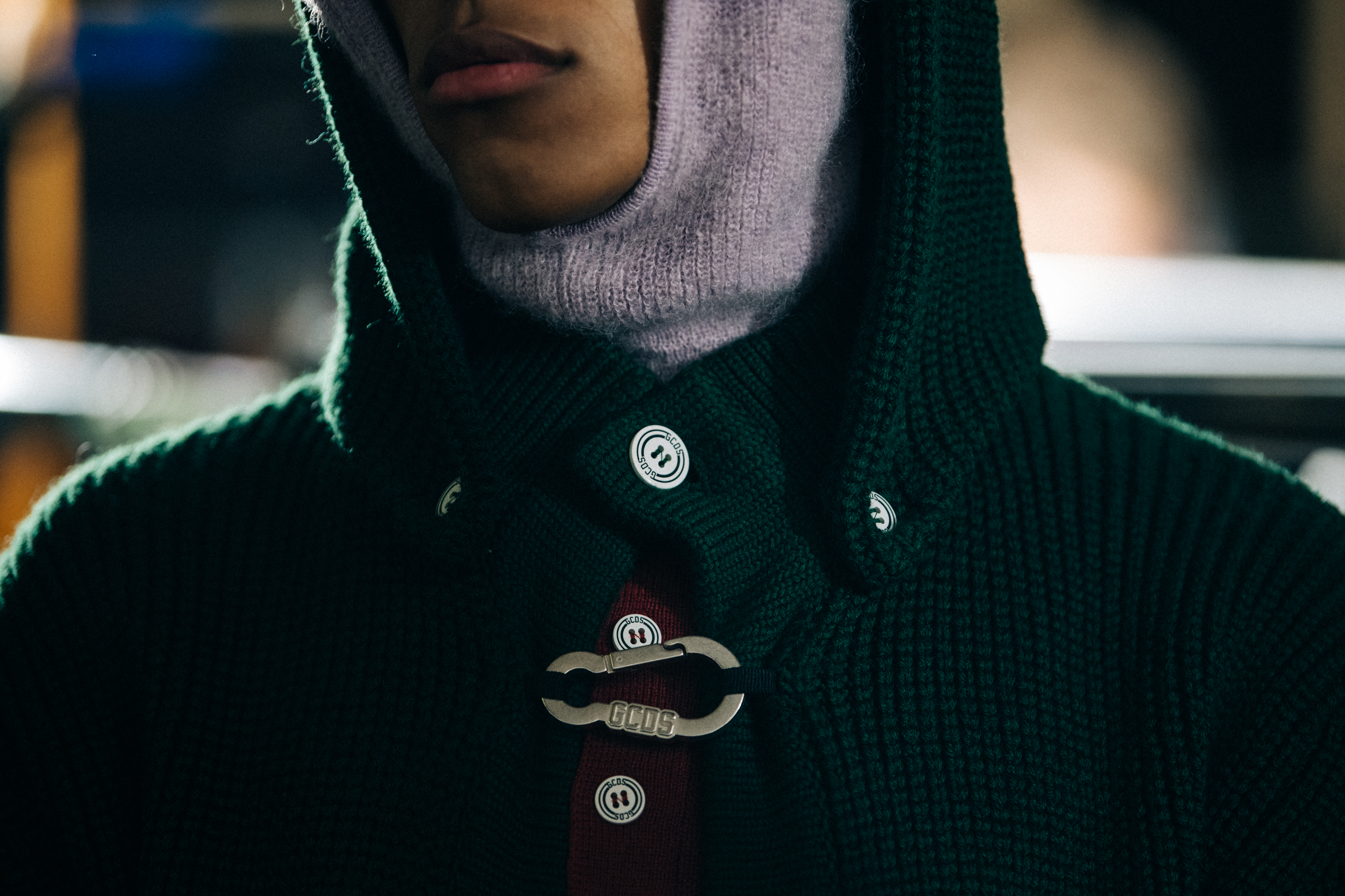 Model wearing green knit cardigan