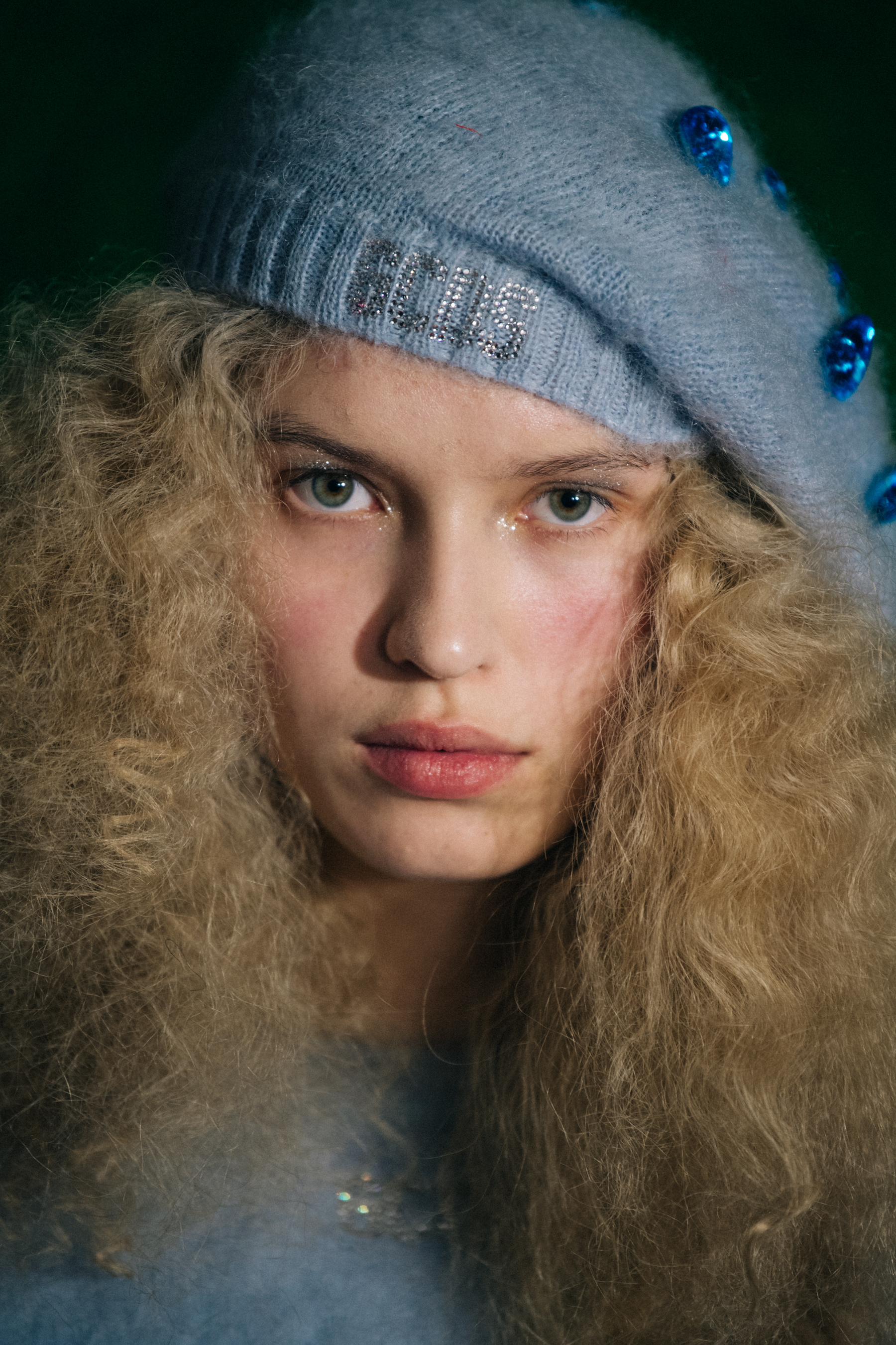 Portrait of model with curly blonde hair
