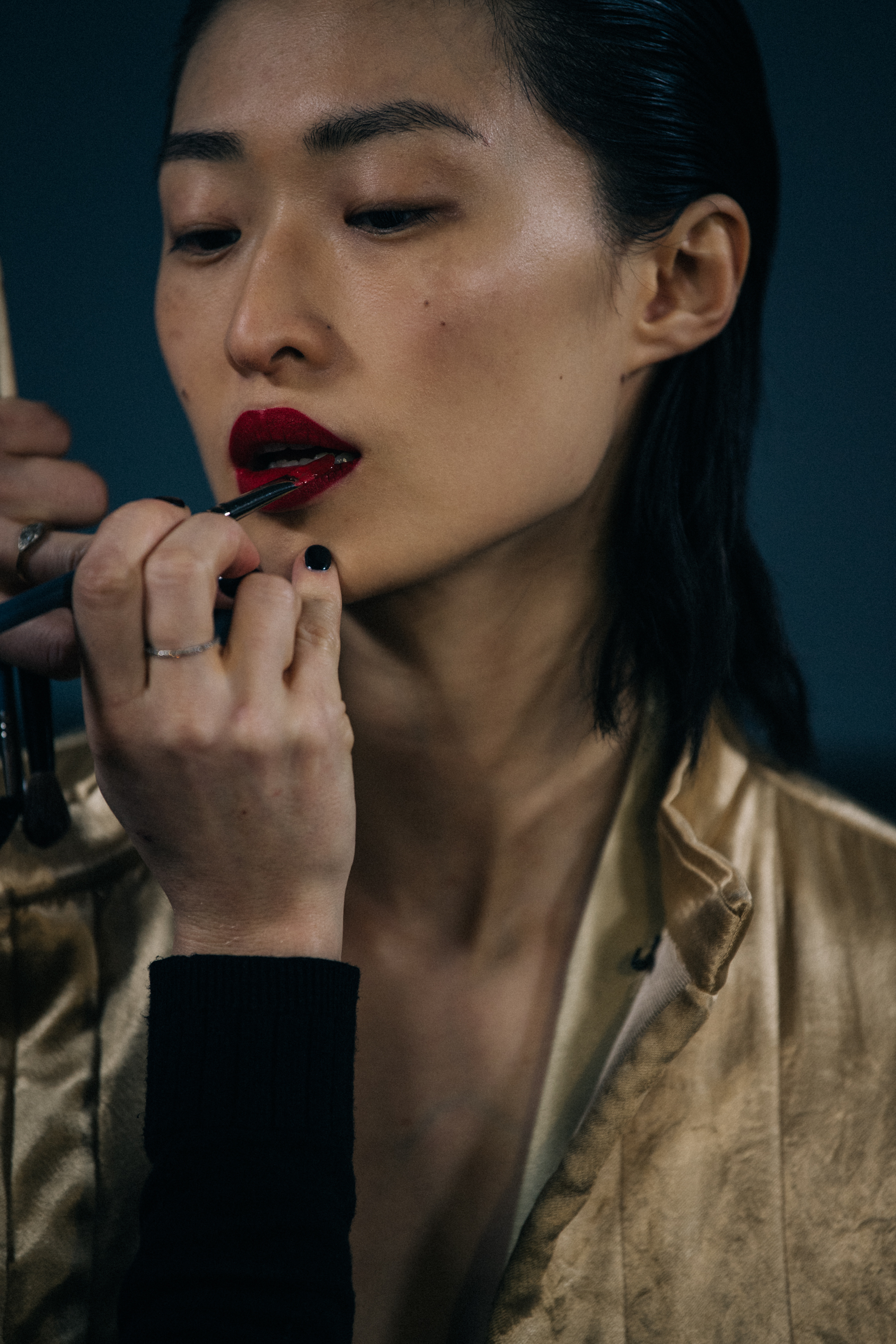 Sora Choi wearing gold at Haider Ackermann