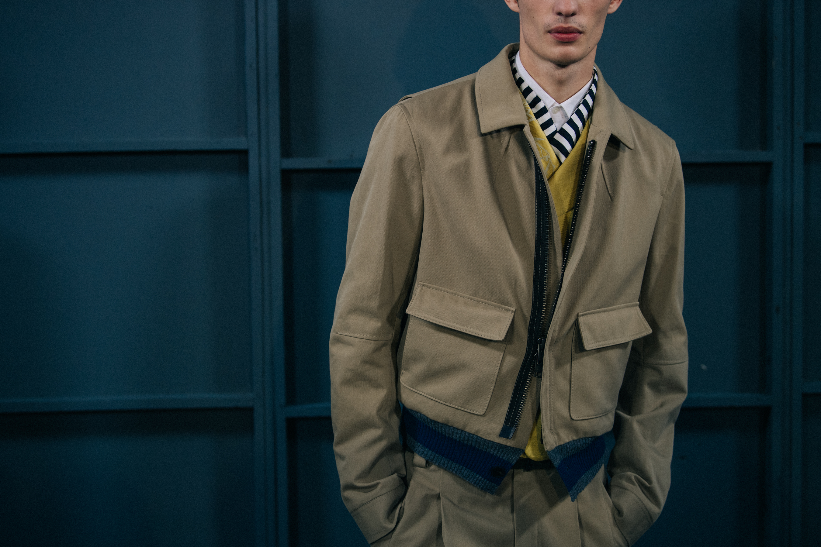 Piero Méndez wearing tan jacket