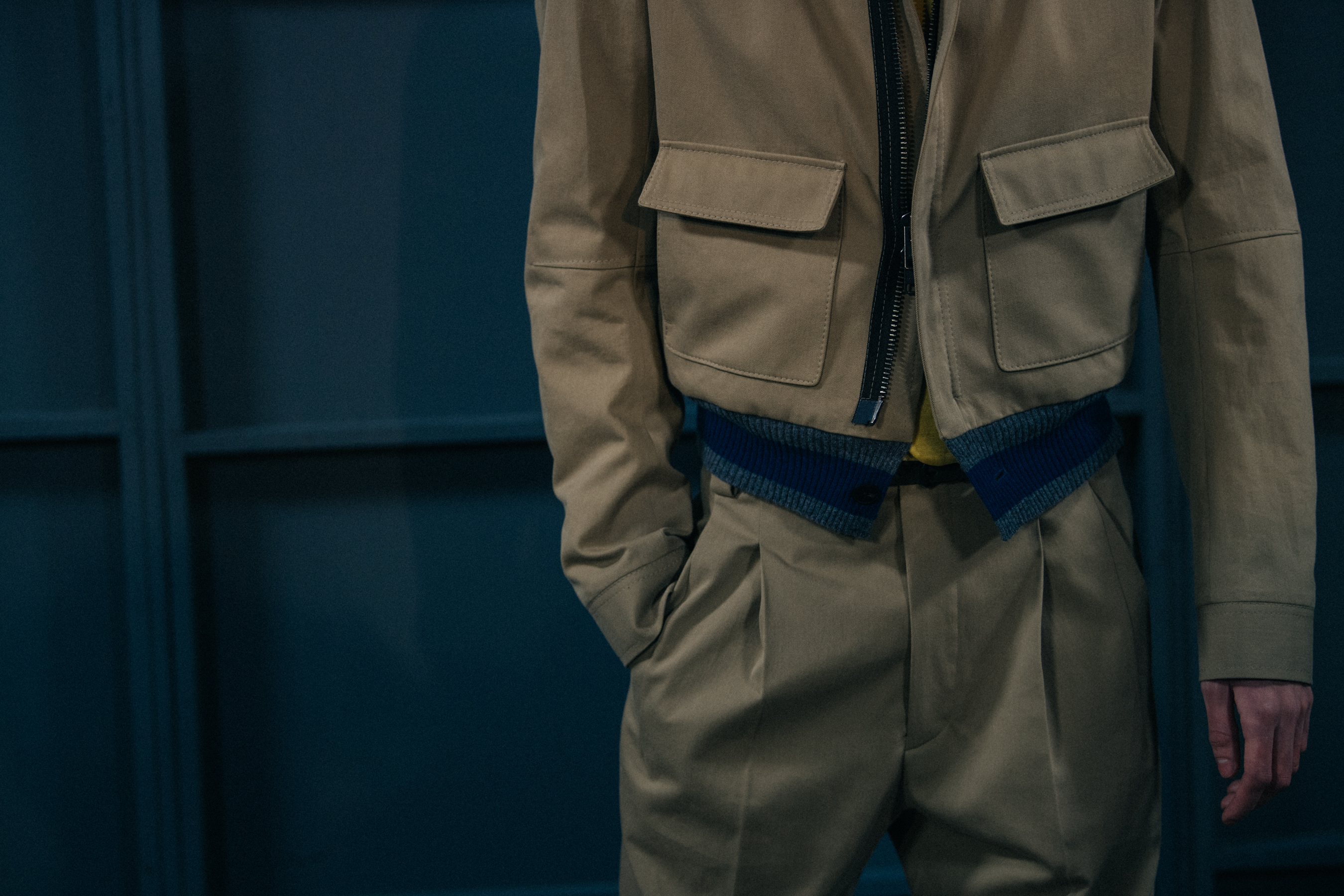 Piero Méndez wearing tan jacket