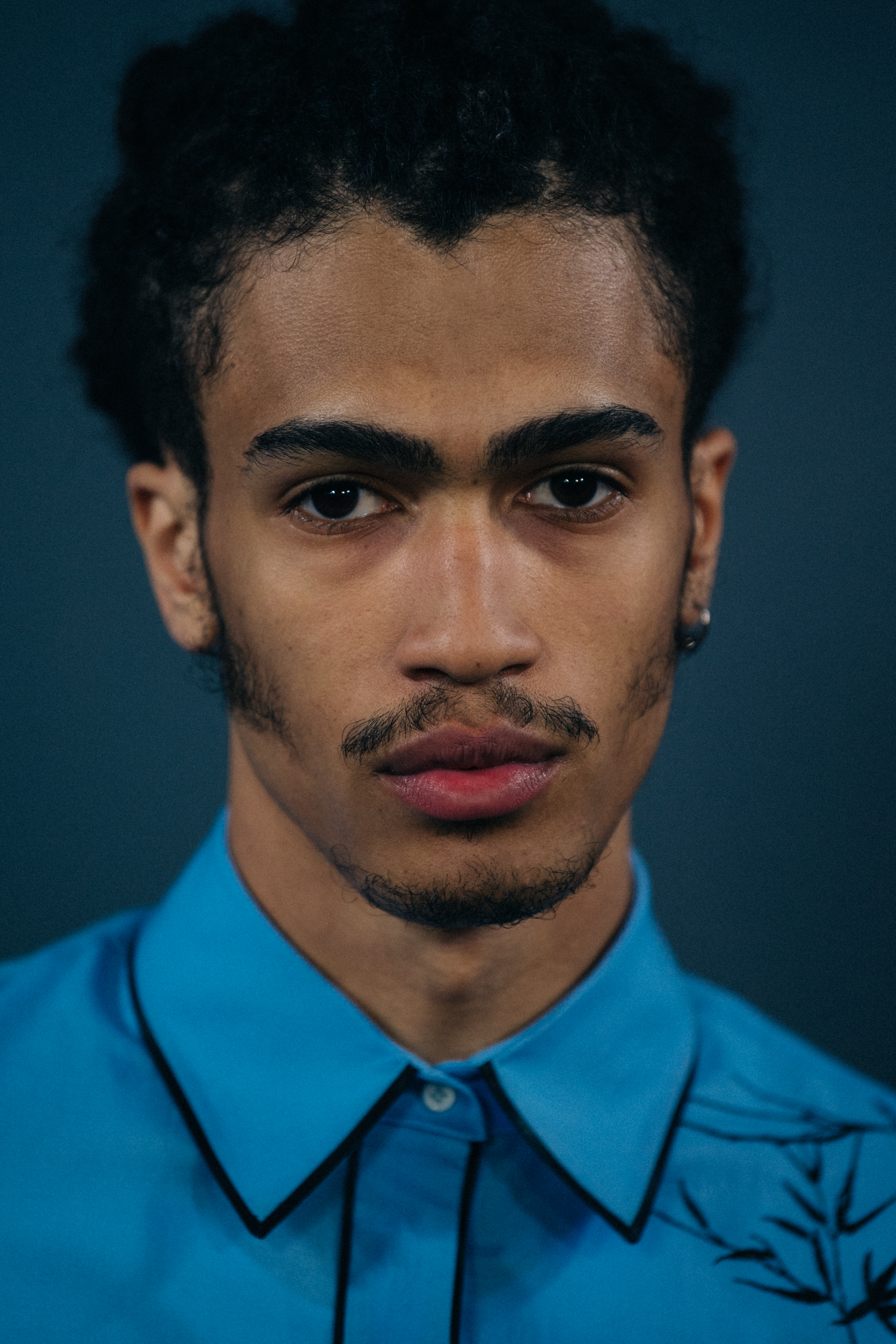 Portrait of model wearing blue shirt