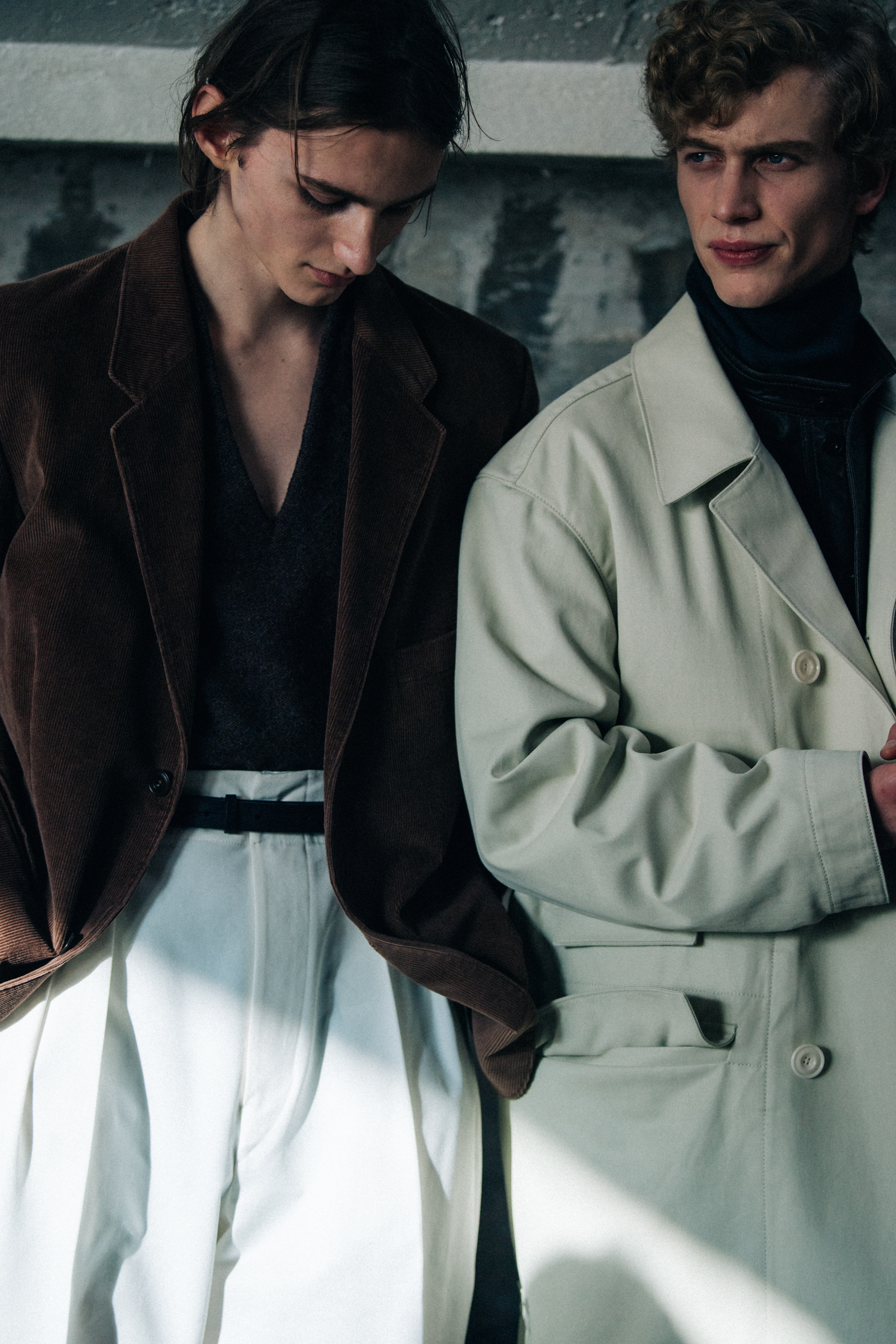 Models wearing brown and white outfits