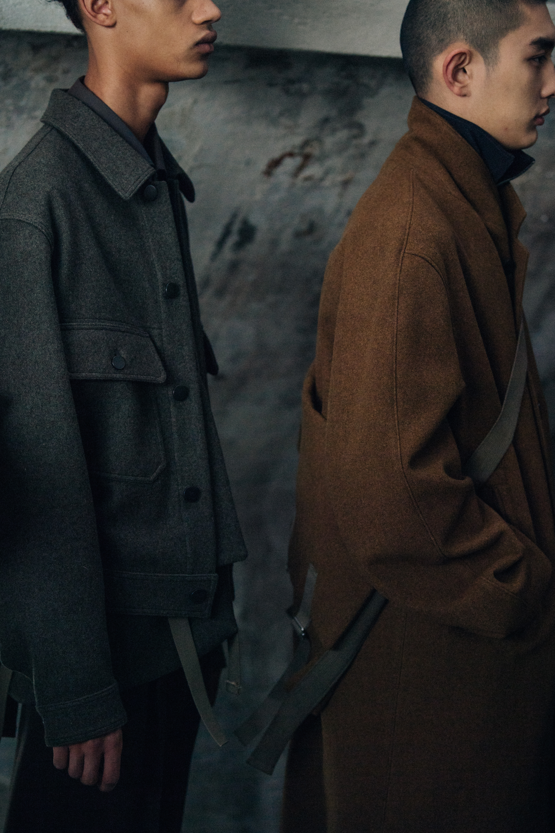 Models wearing wool coats backstage