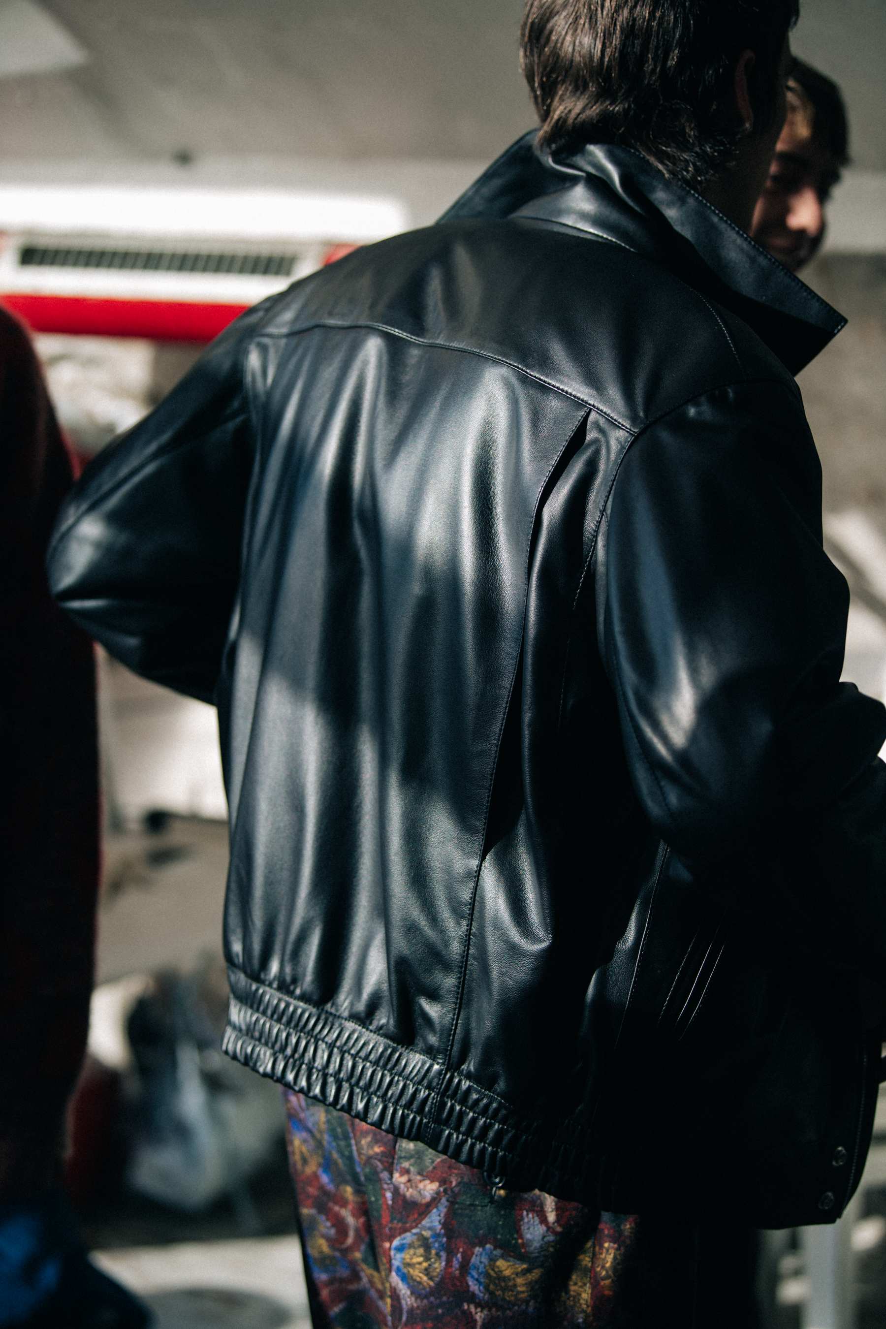 Model wearing black leather jacket