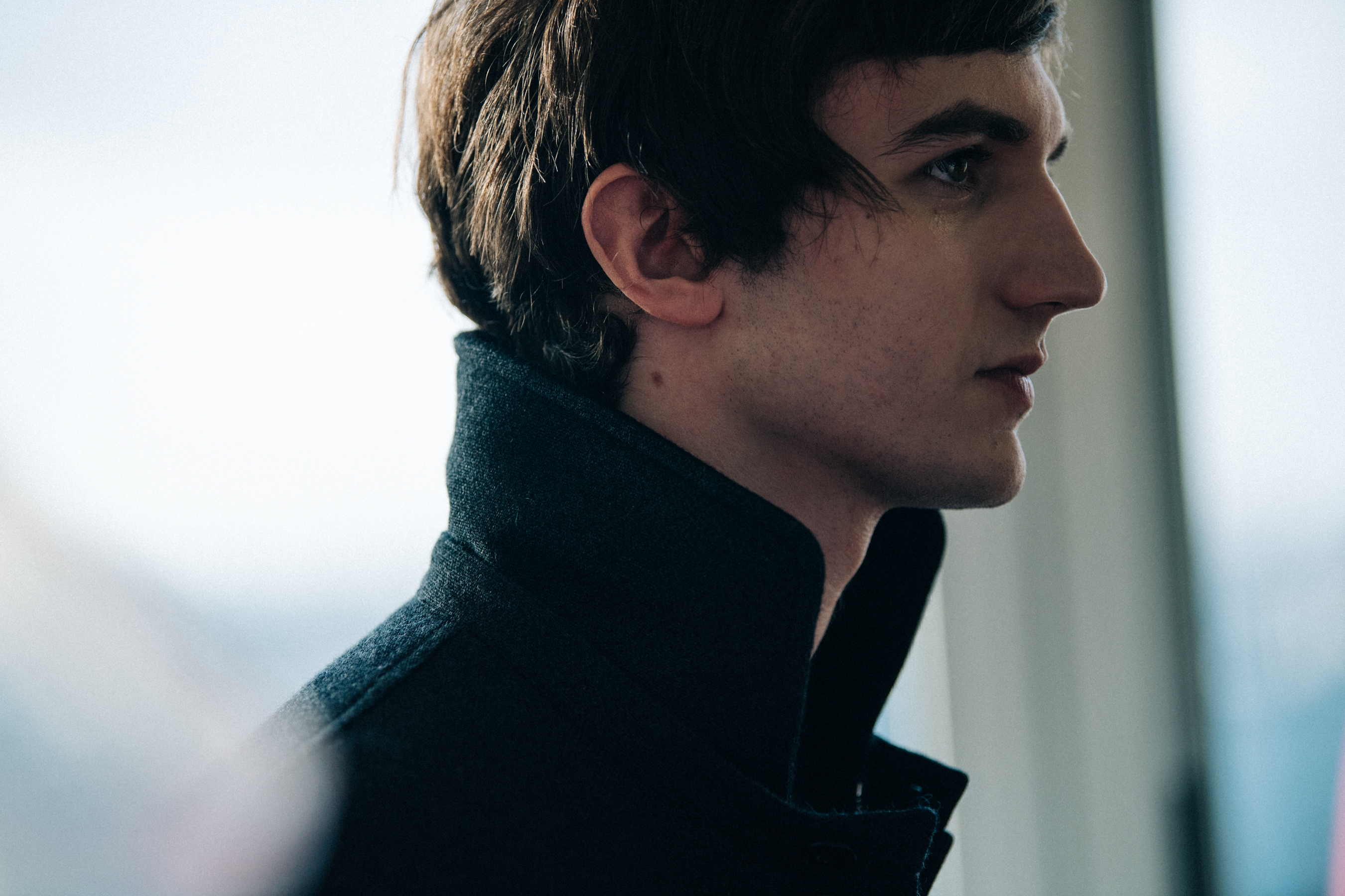 Model wearing grey wool jacket