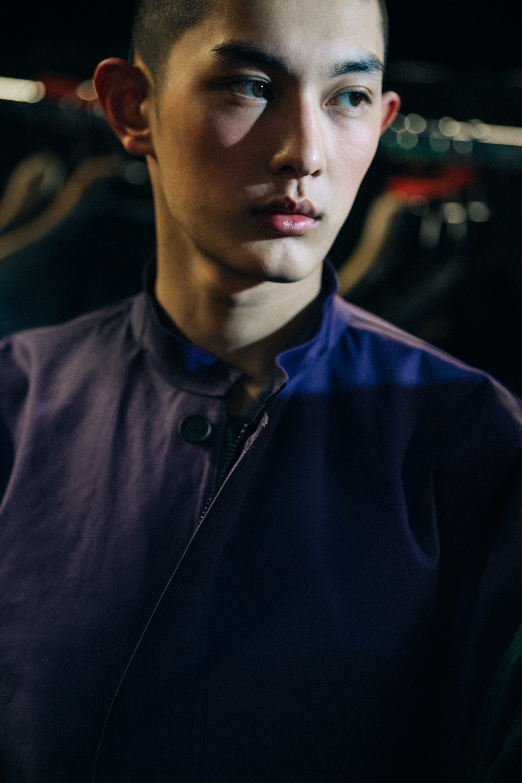 Model wearing purple backstage