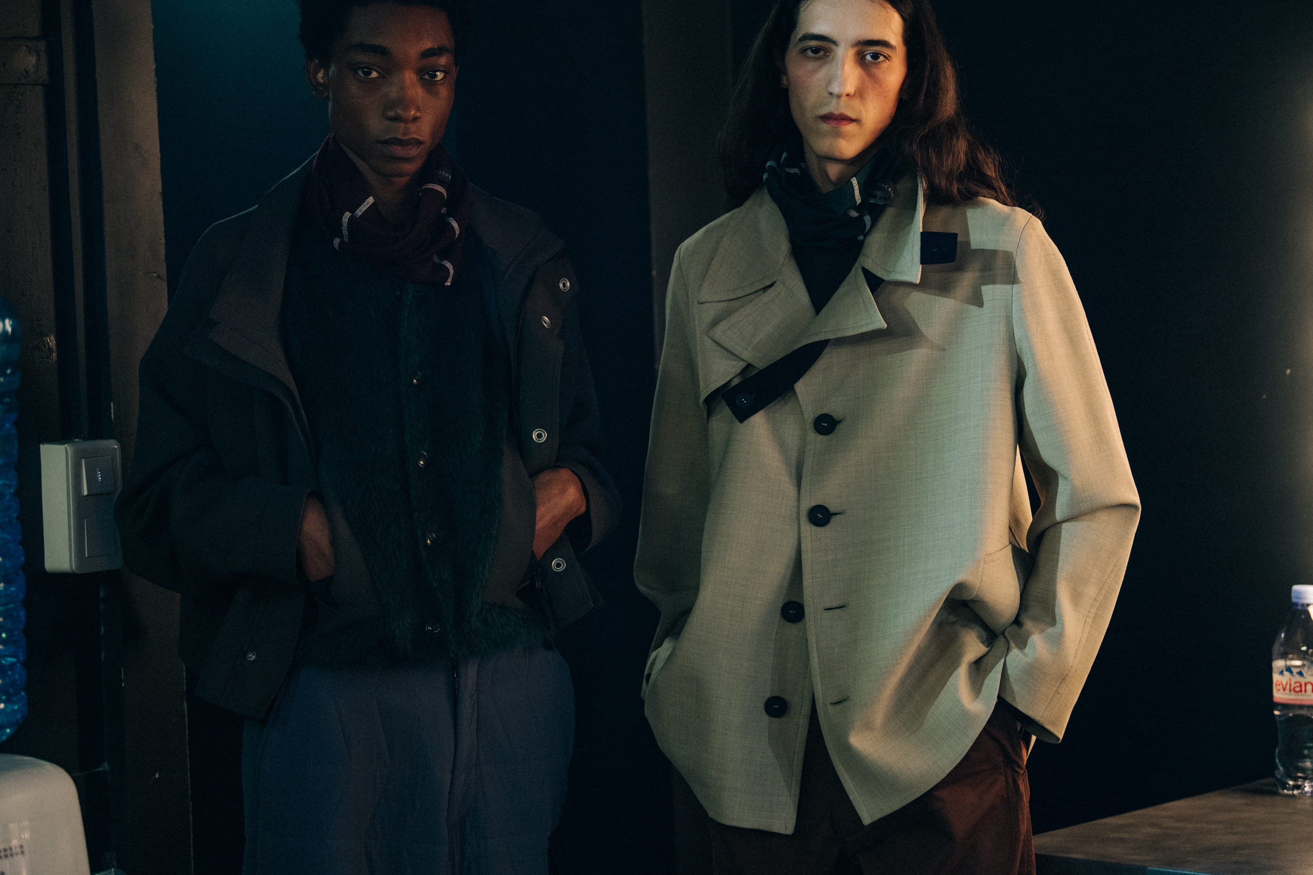 Two models wearing button jackets