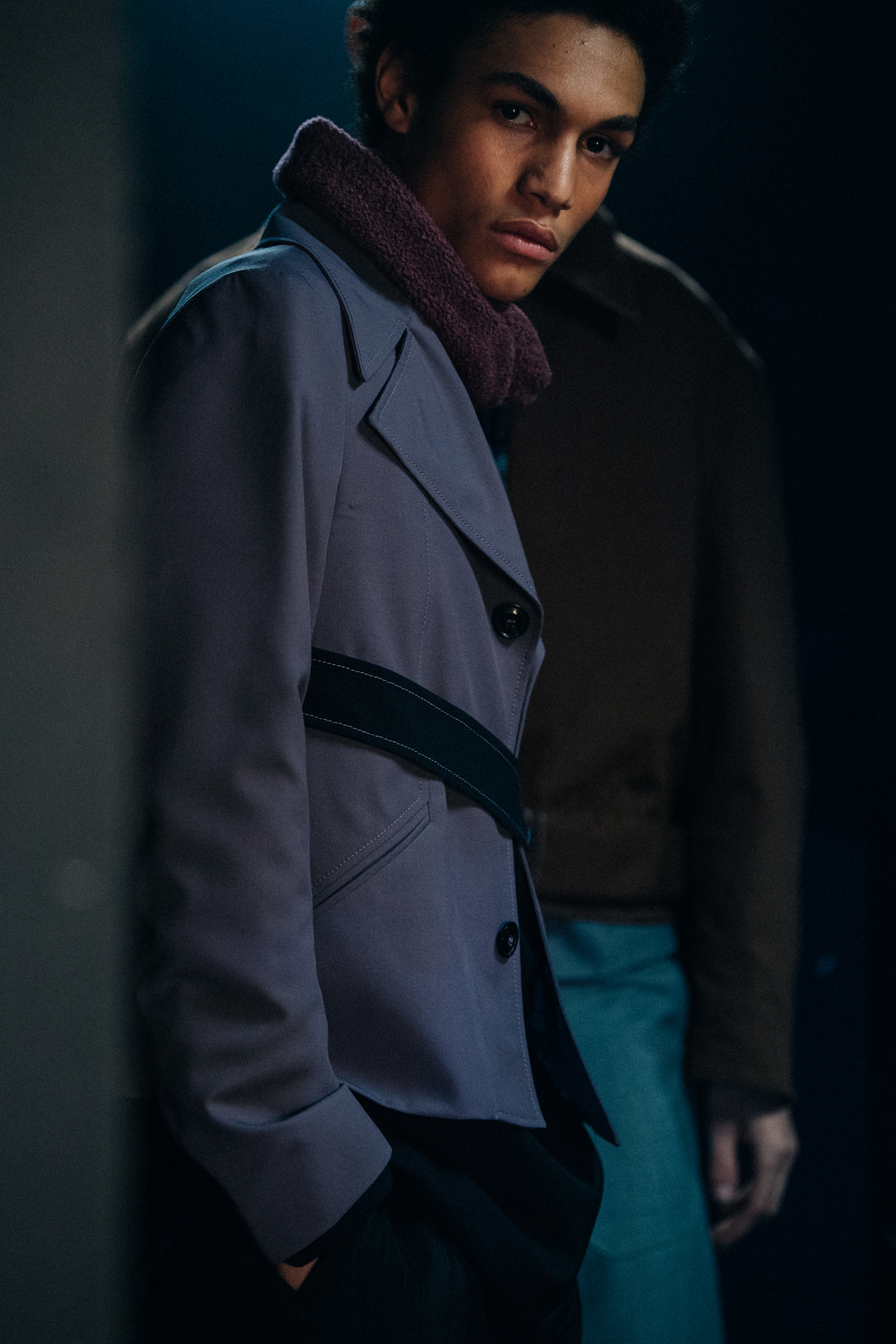 Model wearing dark button up jacket