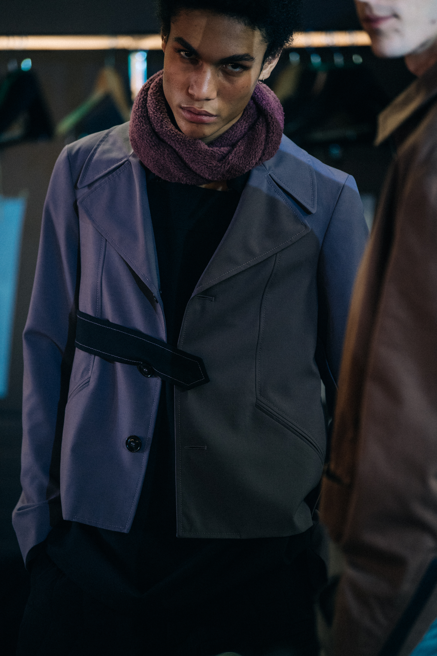 Model wearing dark button up jacket