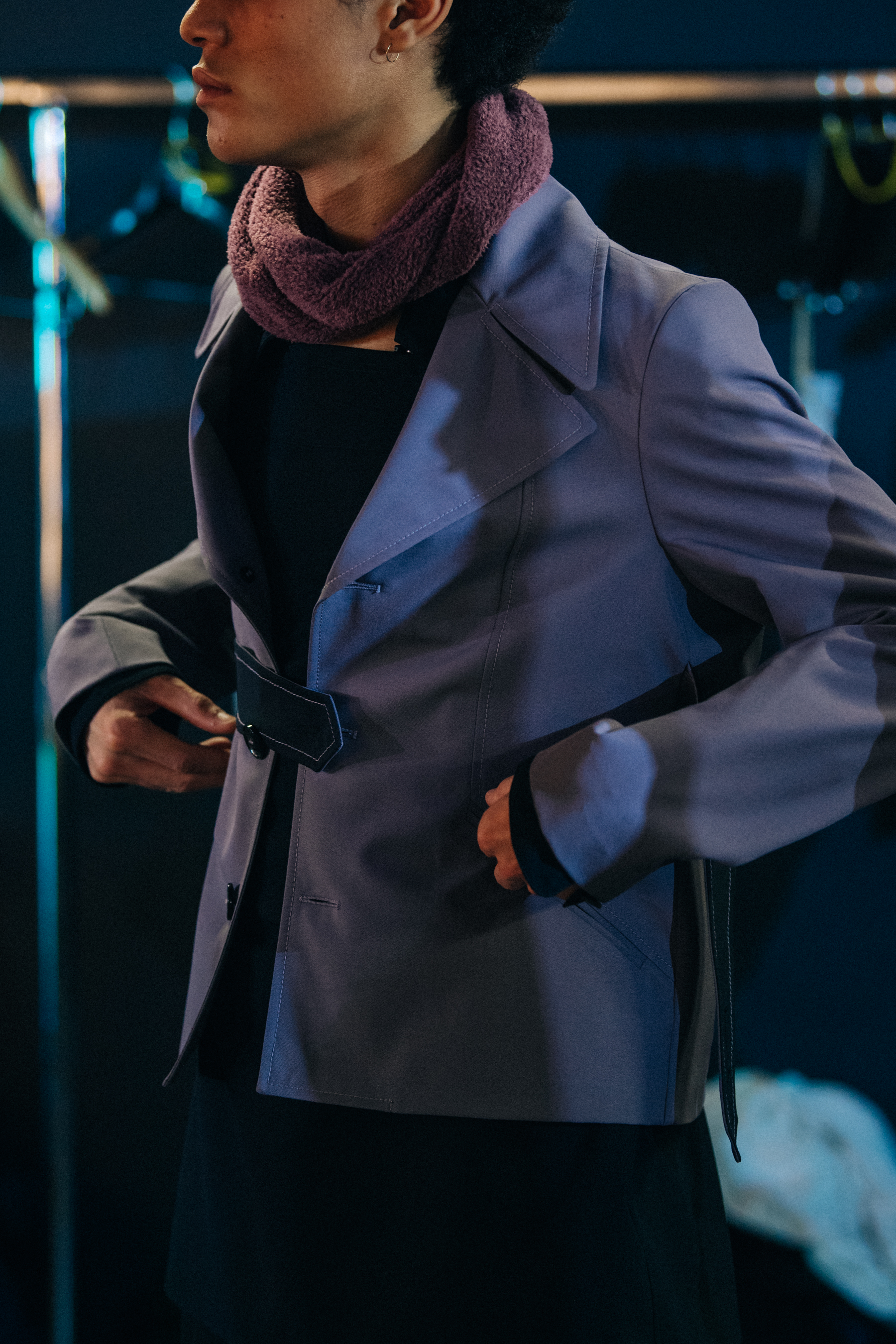 Model wearing dark button up jacket