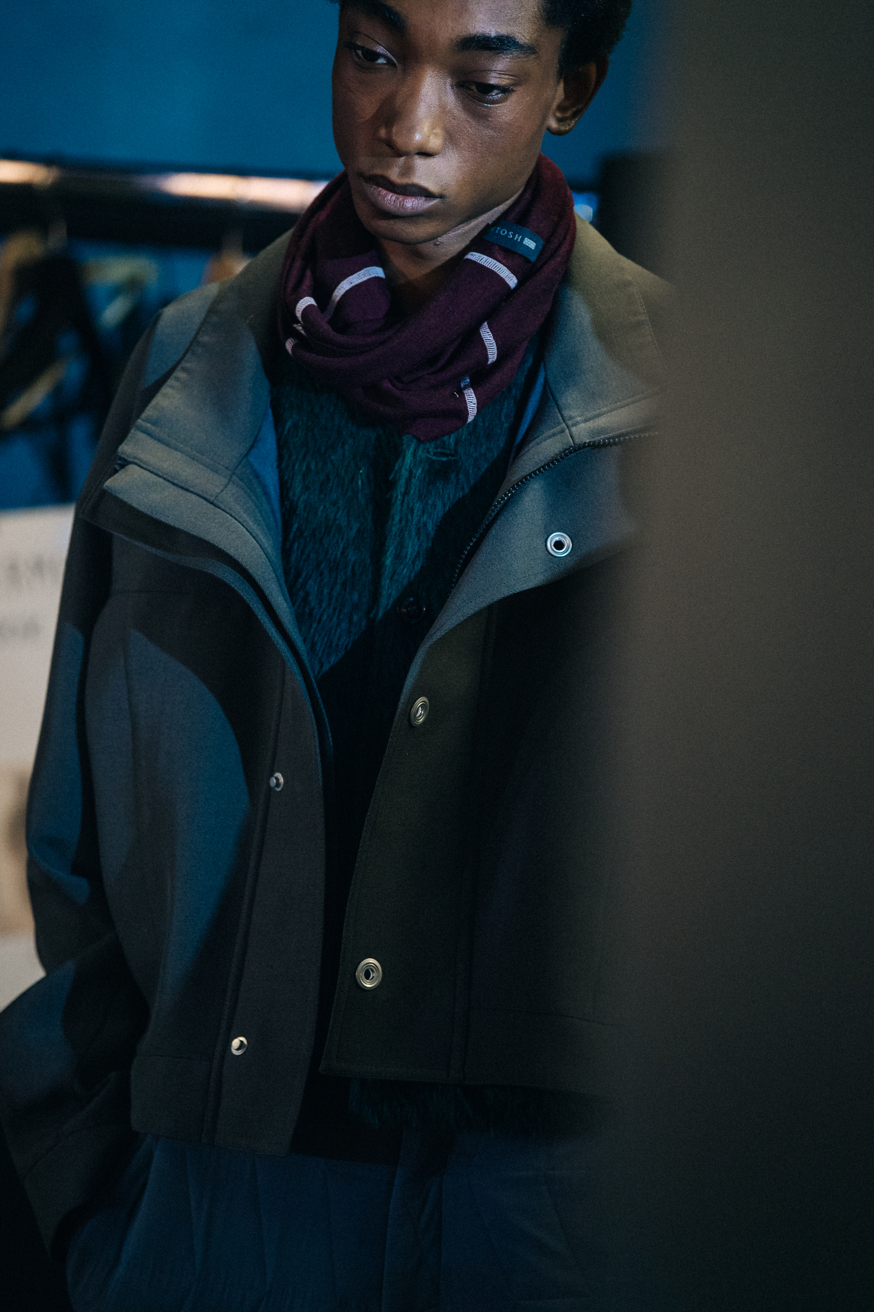 Model wearing dark button up jacket