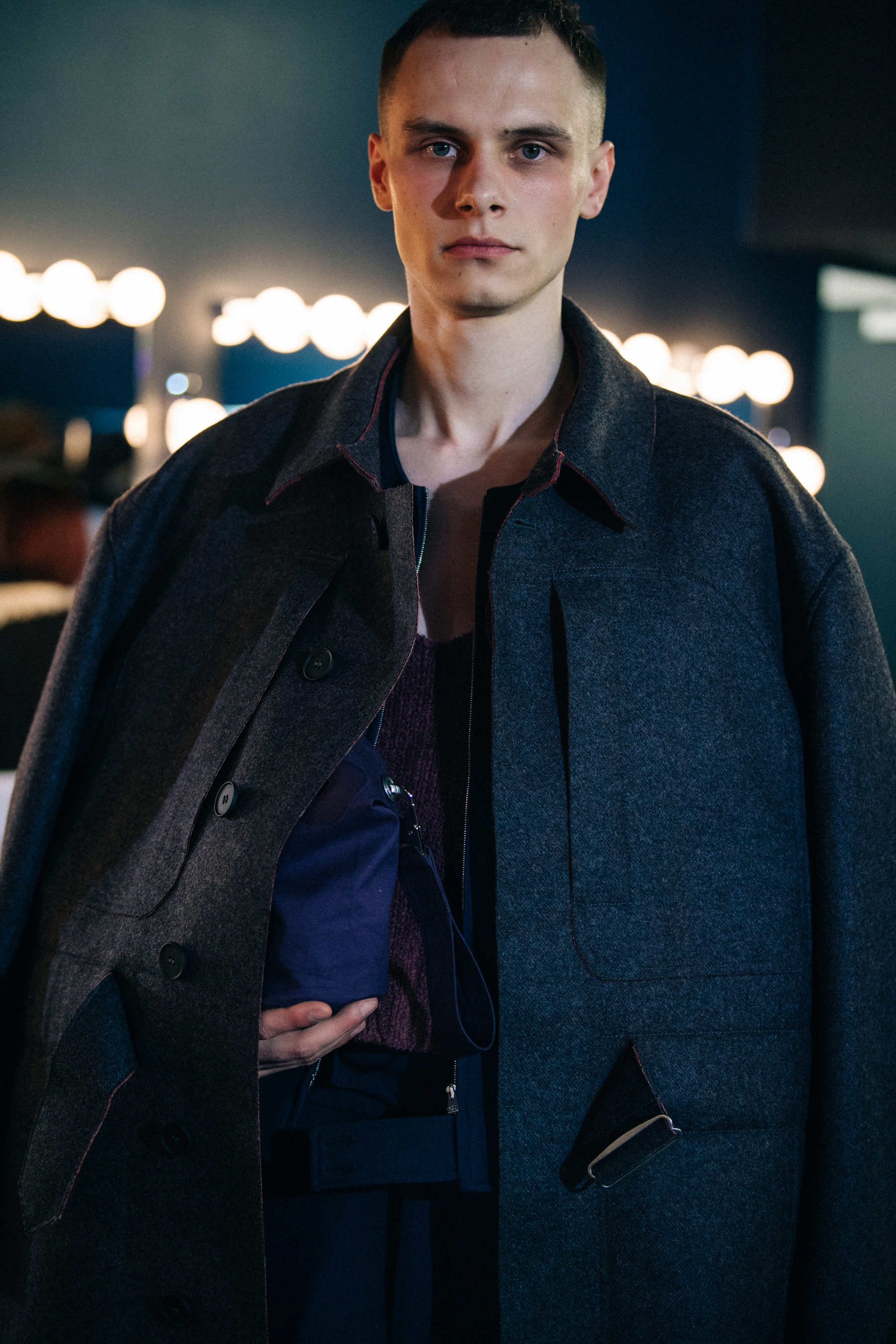 Model wearing dark grey jacket