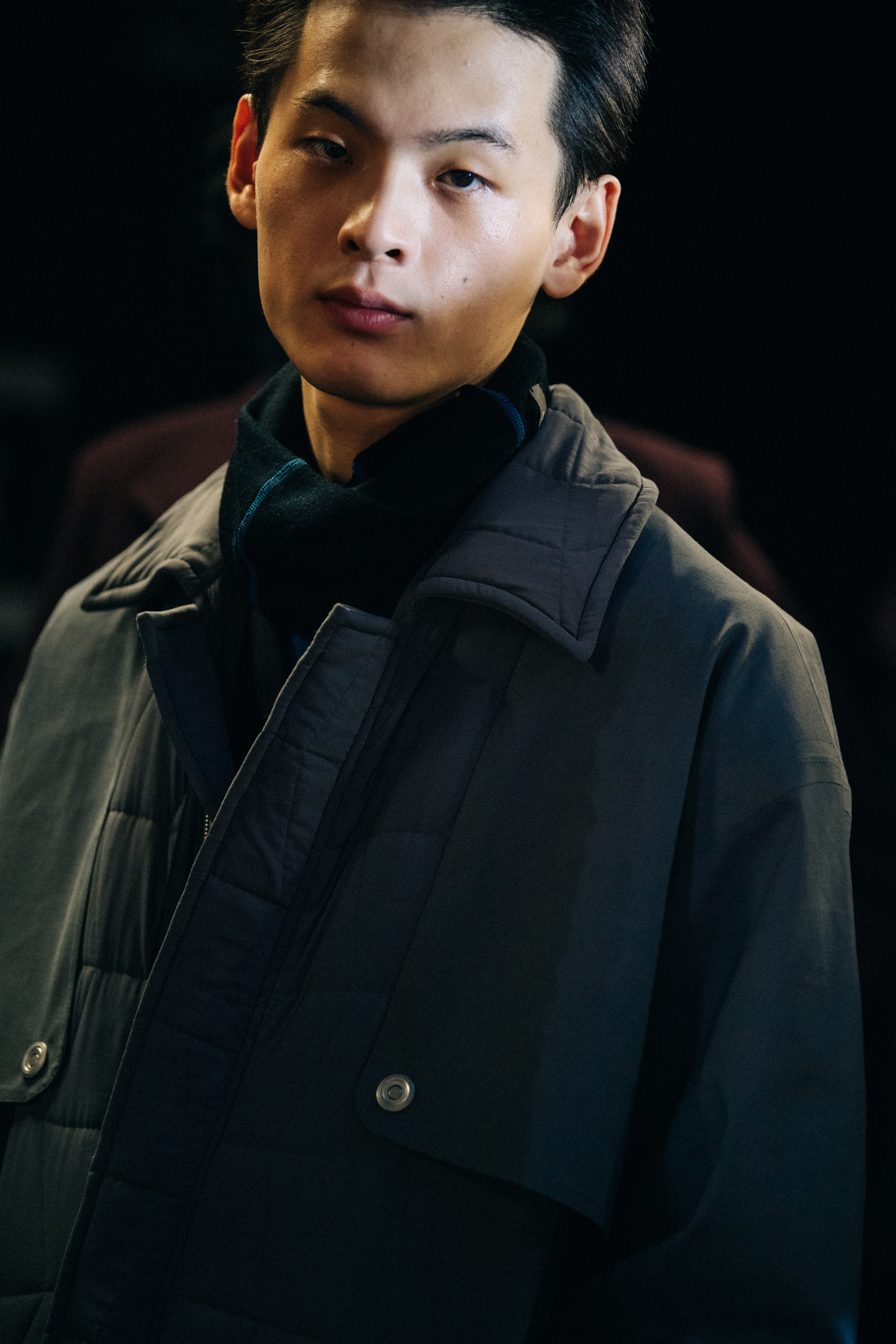 Model wearing dark grey jacket