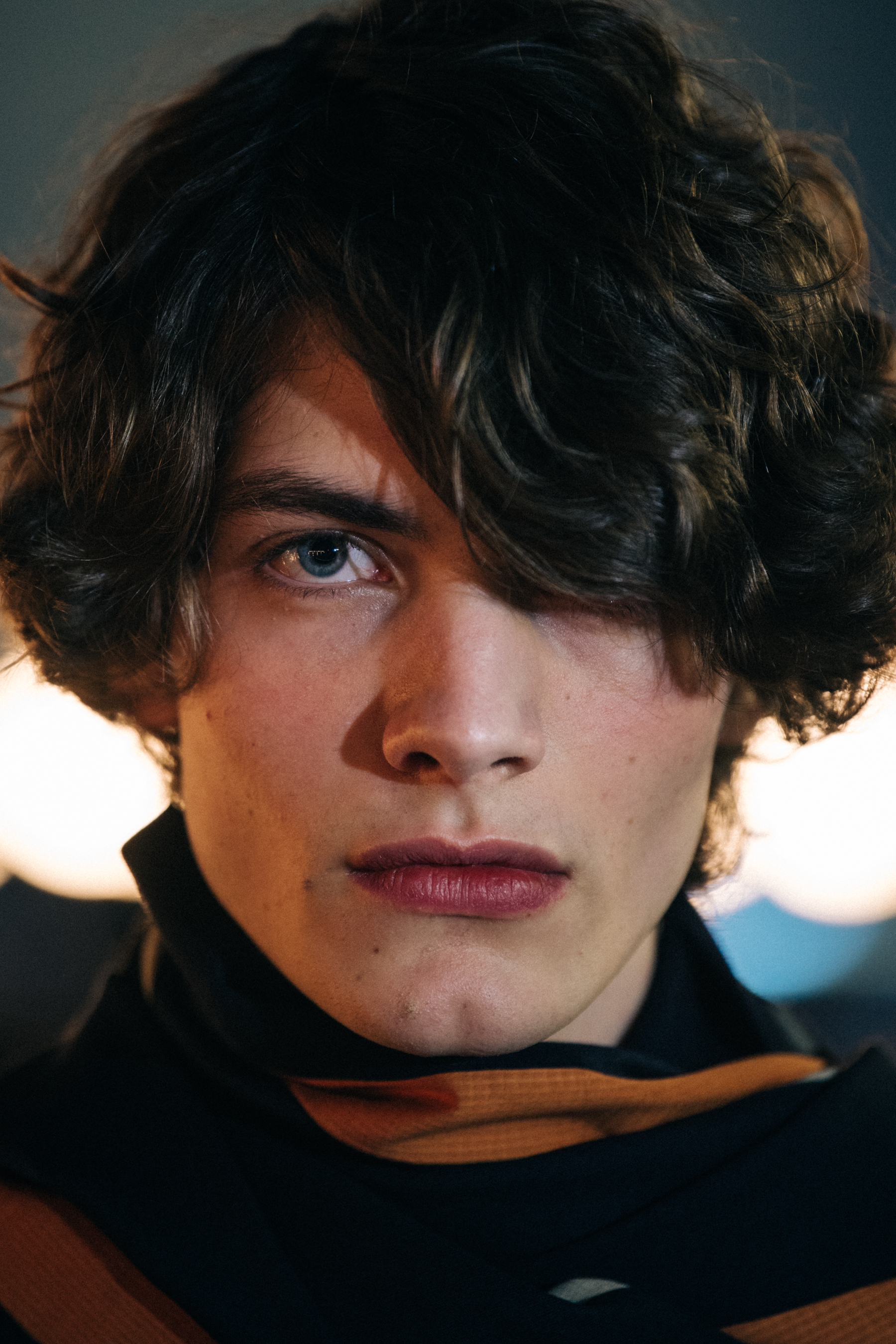 Portrait of model wearing orange scarf