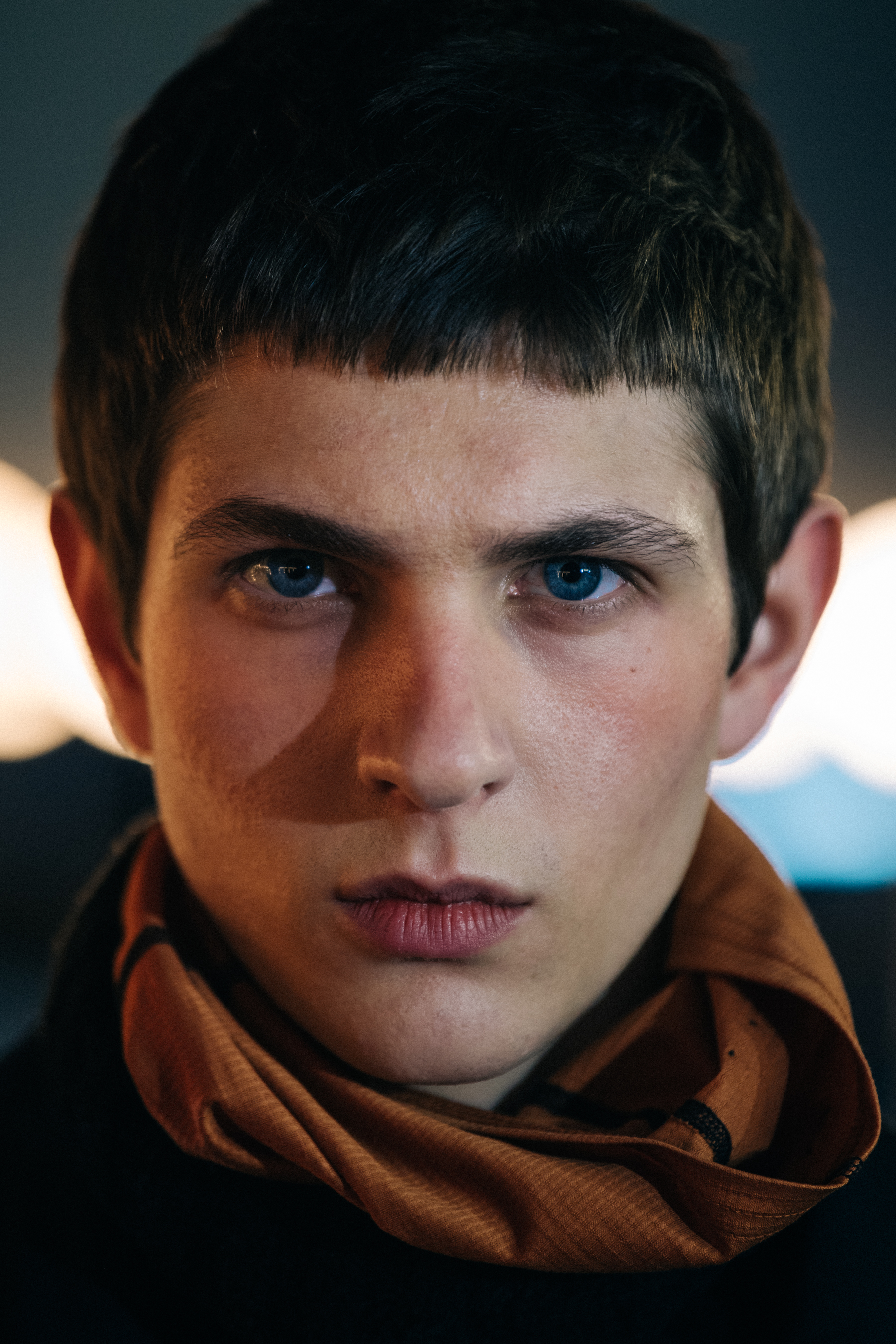 Portrait of model wearing orange scarf