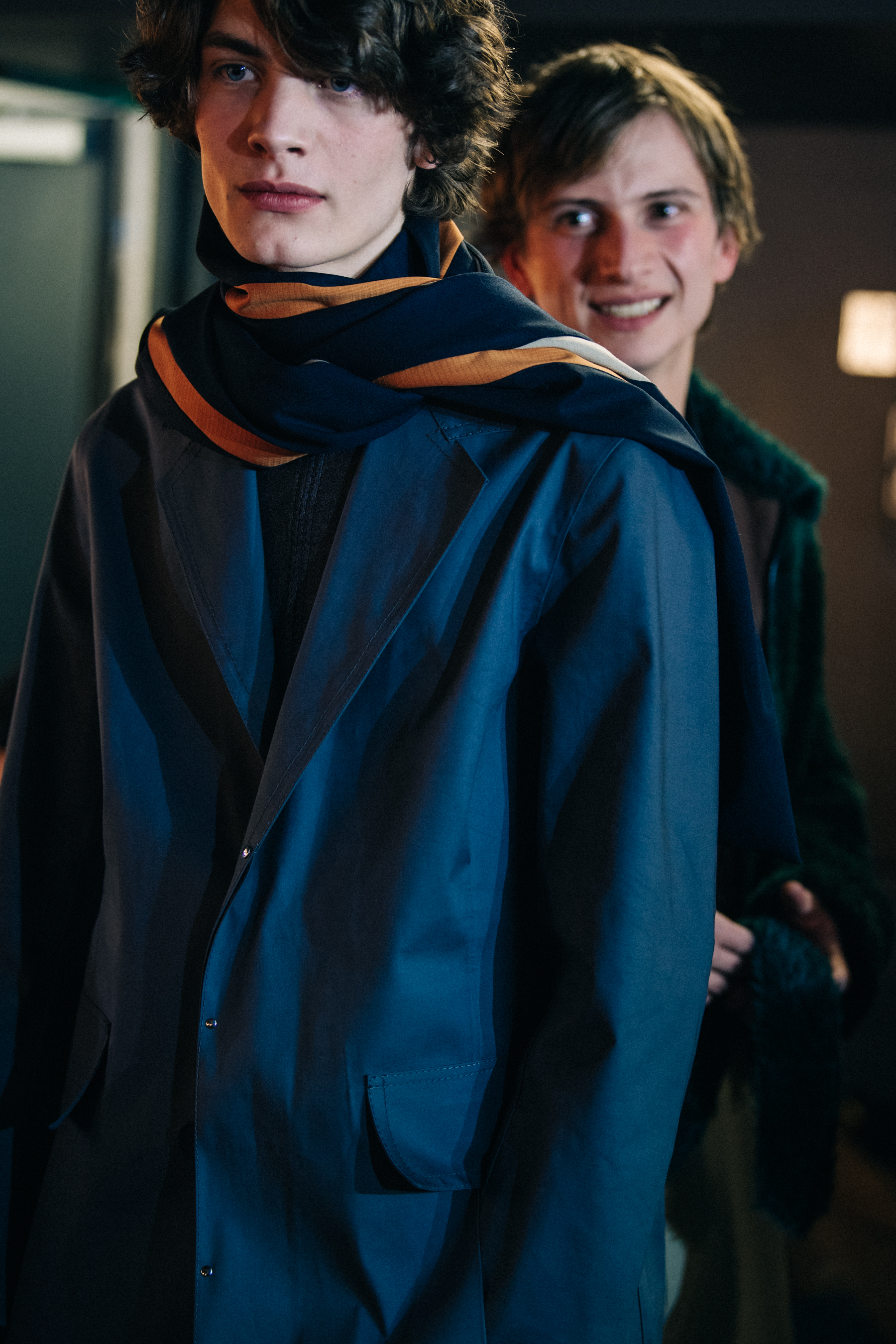 Model wearing dark grey jacket