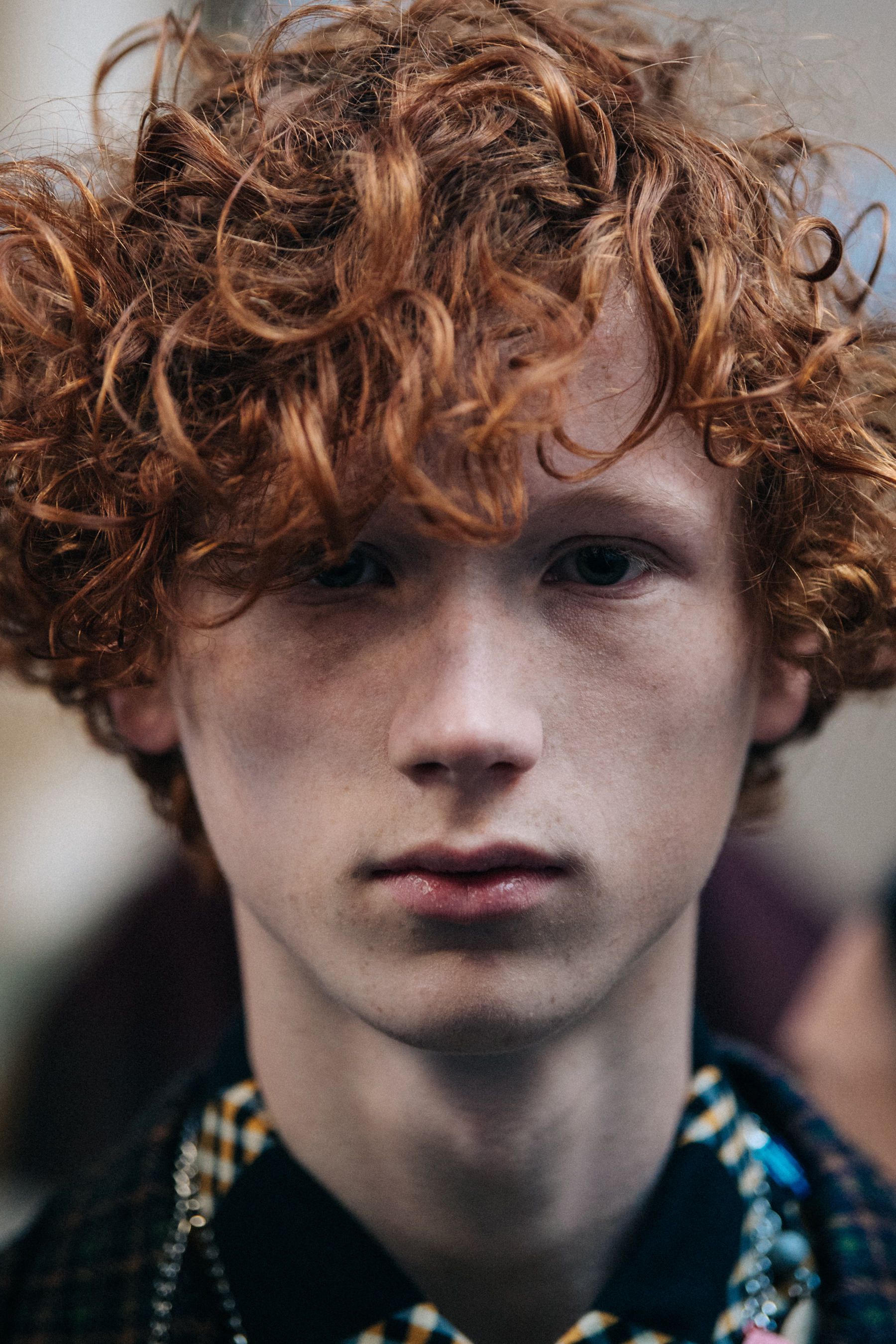 Portrait of model with curly ginger hair