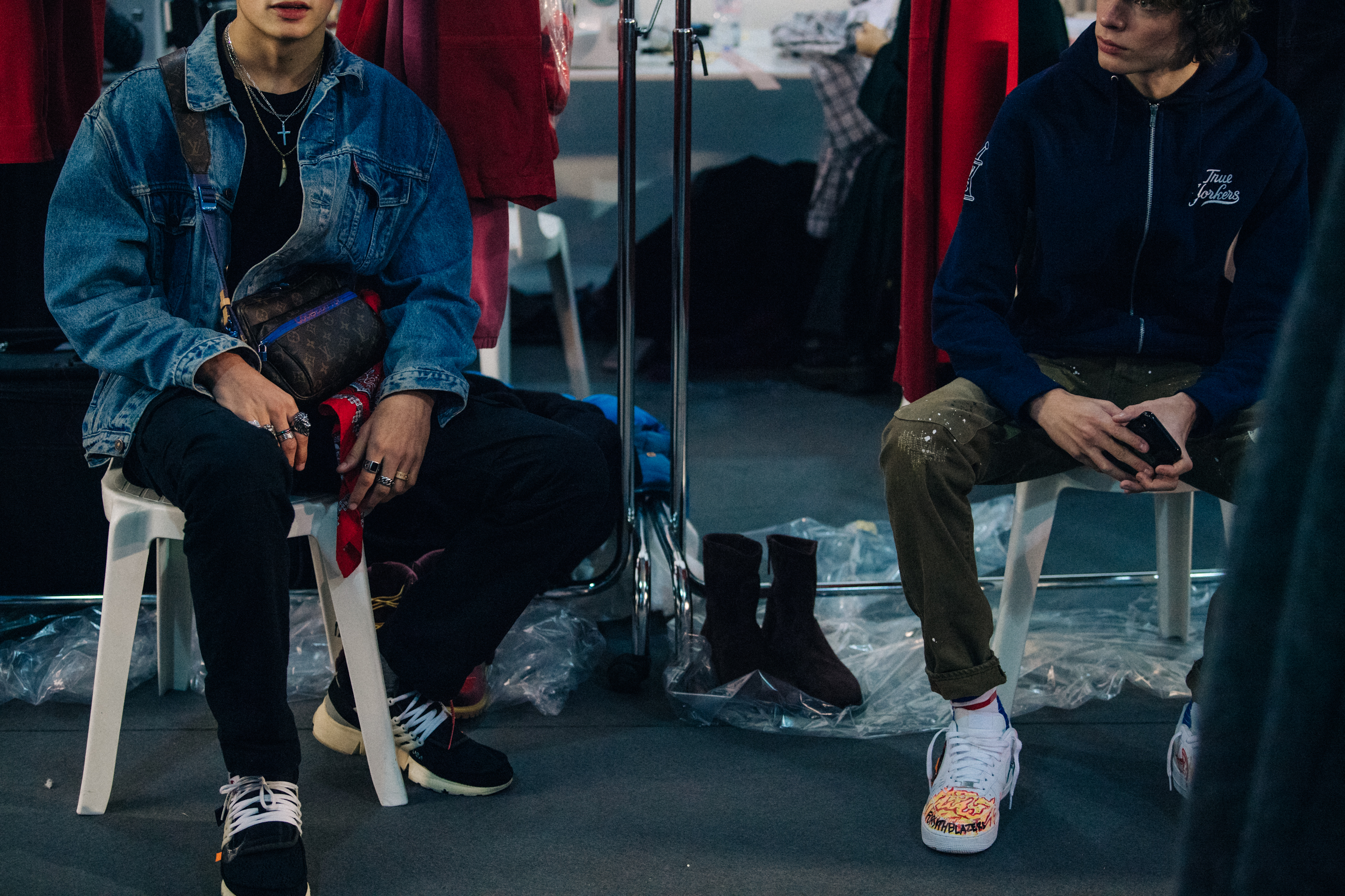Models sat backstage at Off-White FW18