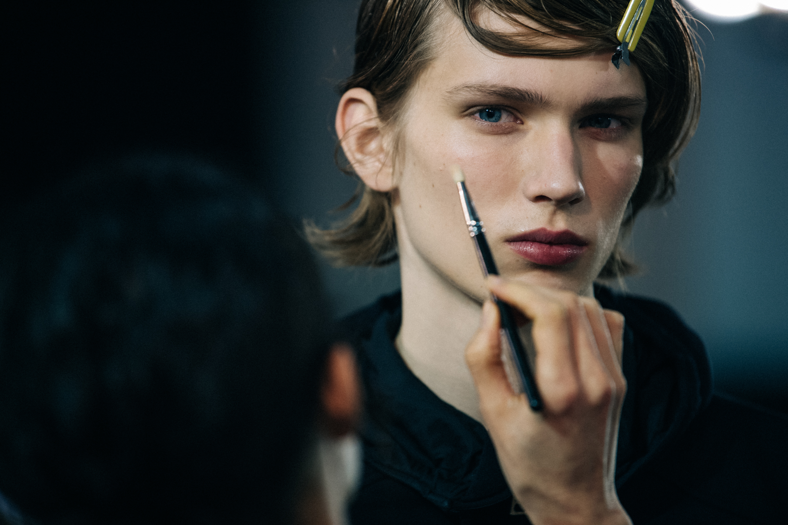 Model in makeup backstage