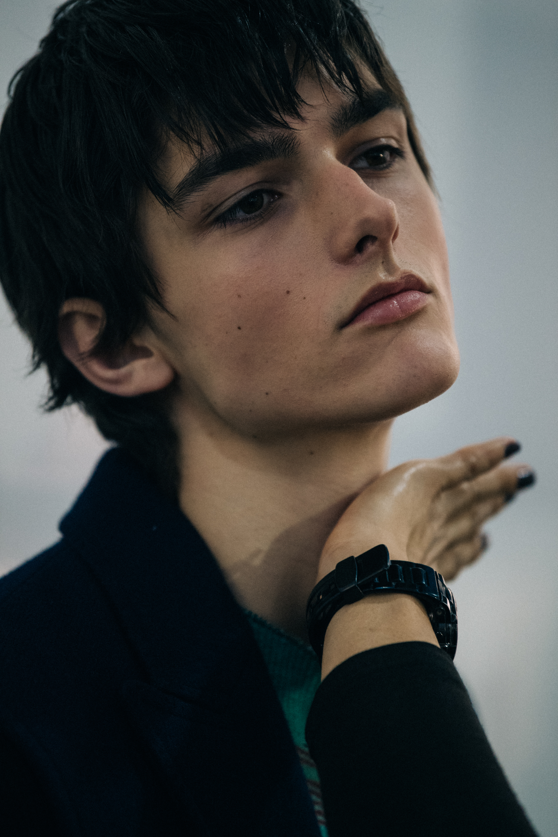 Model wearing green jumper backstage