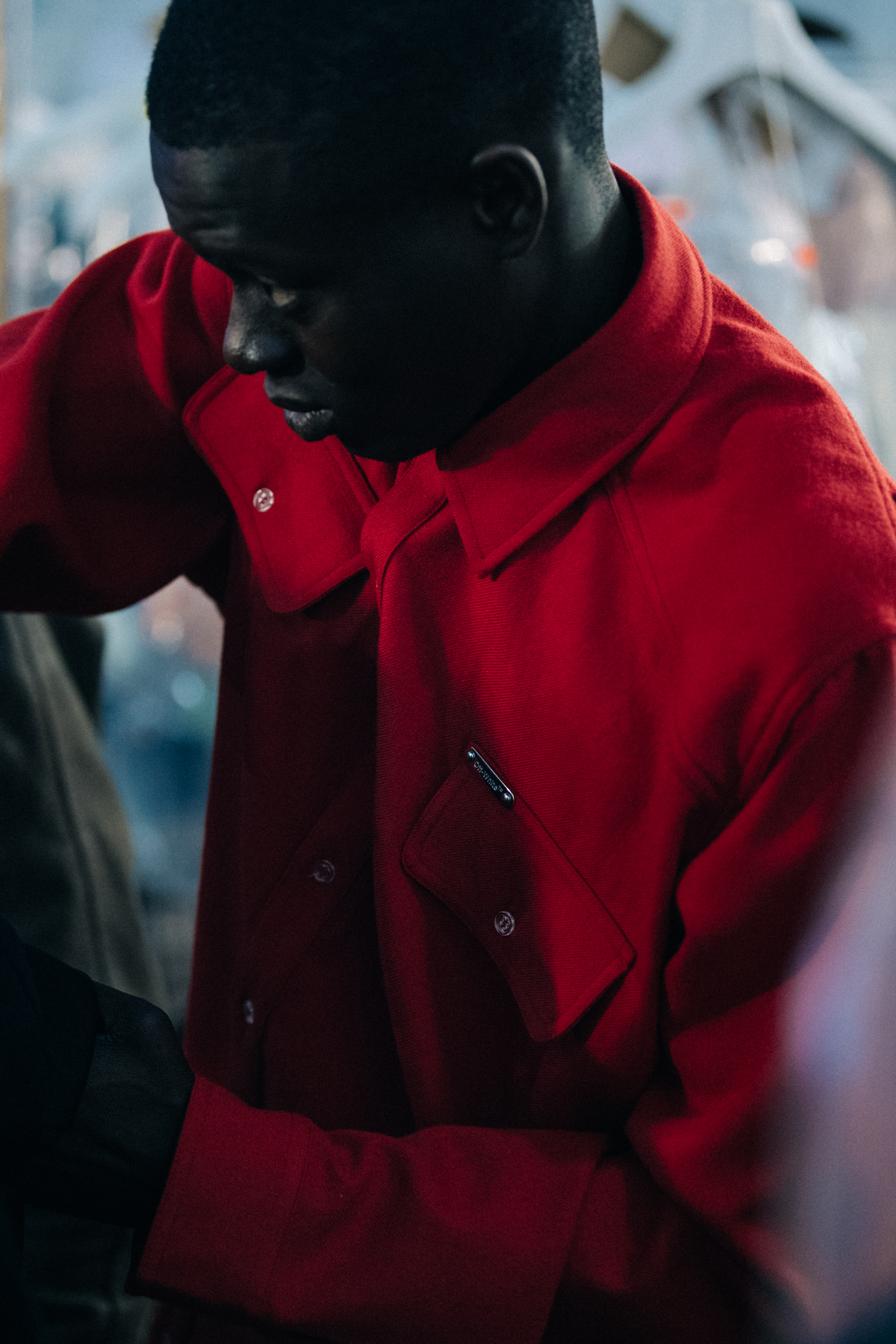 Alpha Dia wearing red Off-White shirt