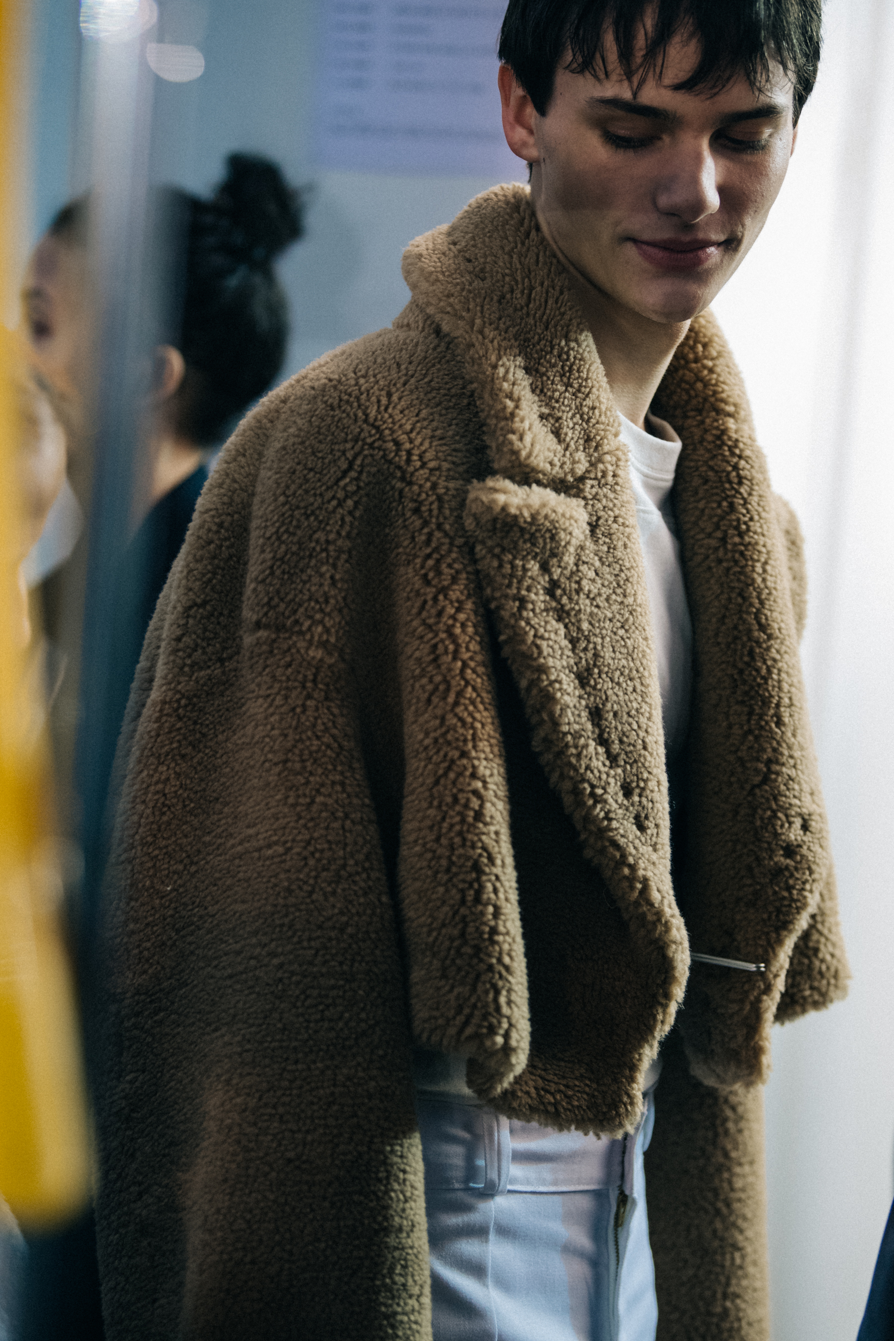 Model wearing brown fur coat