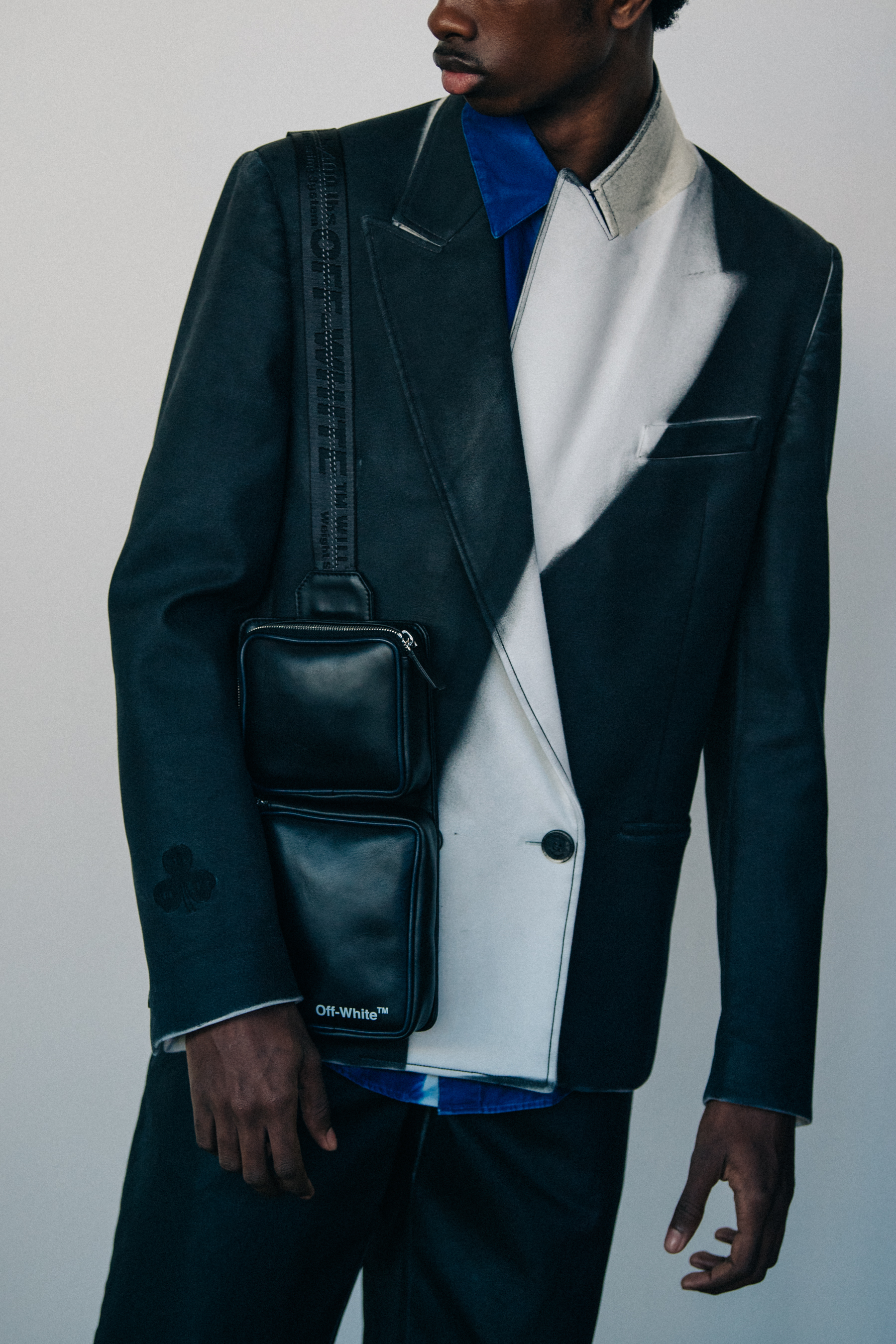 Model wearing jacket with bag