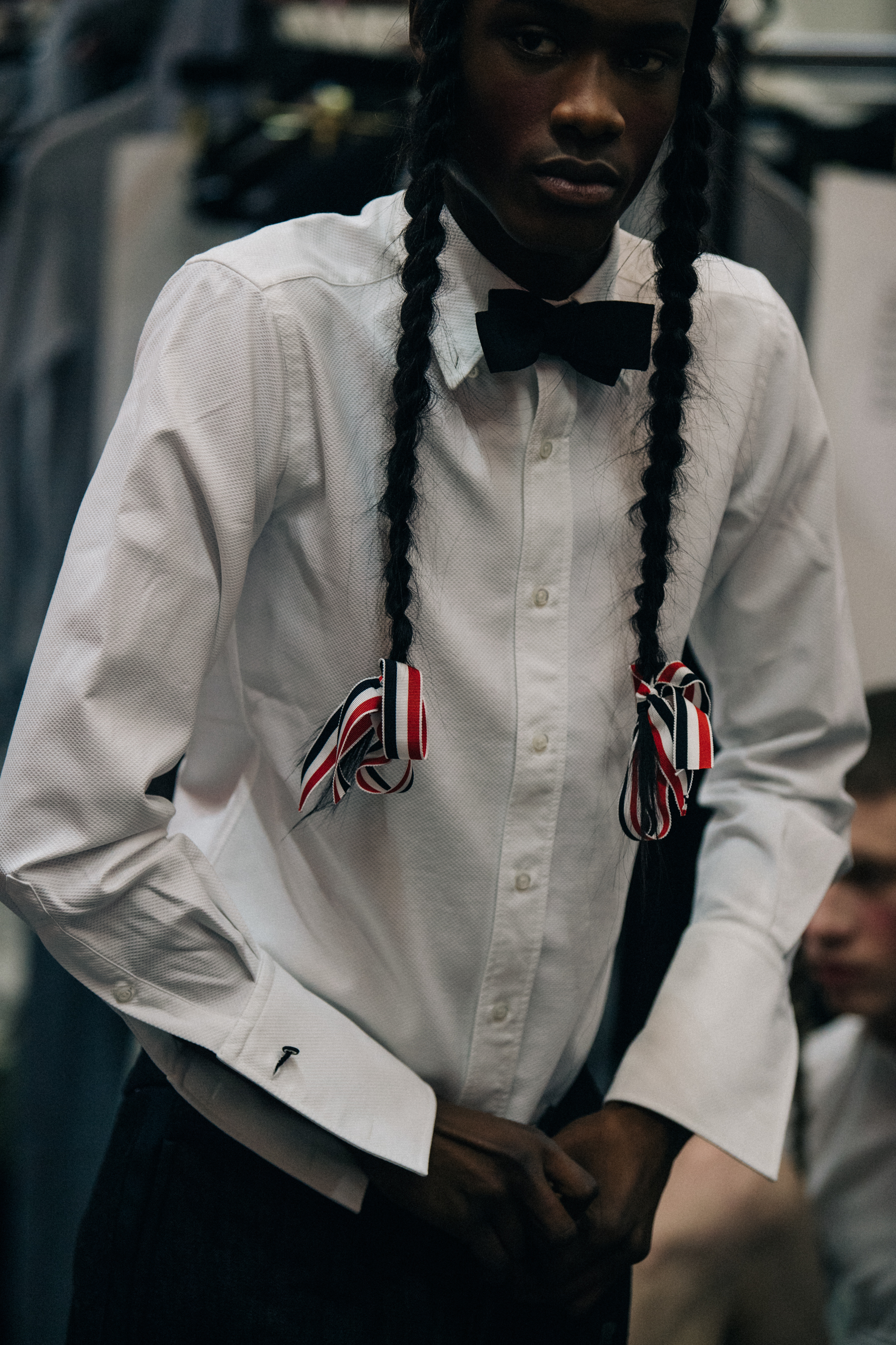 Model wearing white shirt at Thom Browne
