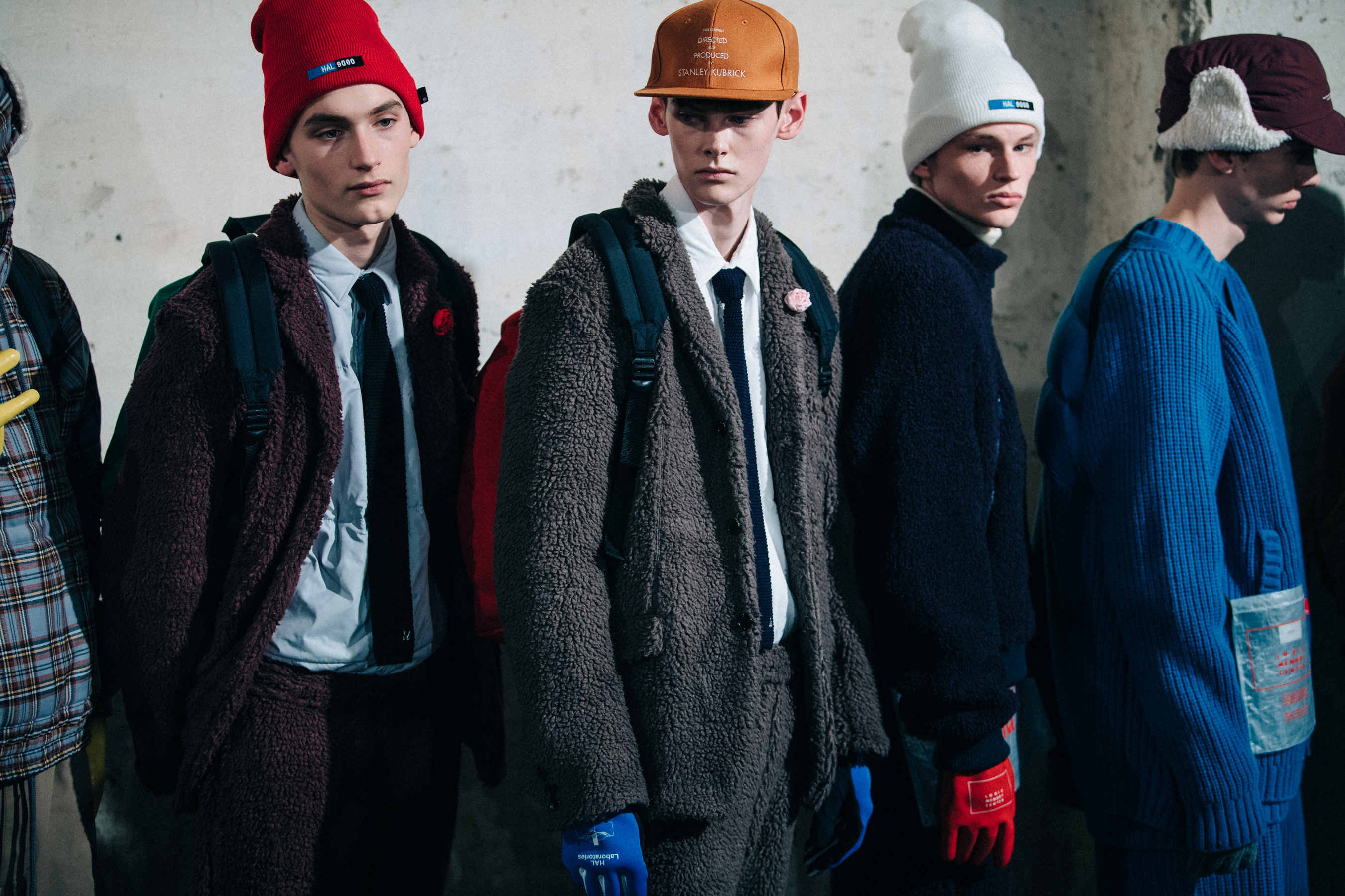 Models wearing colourful outfits backstage
