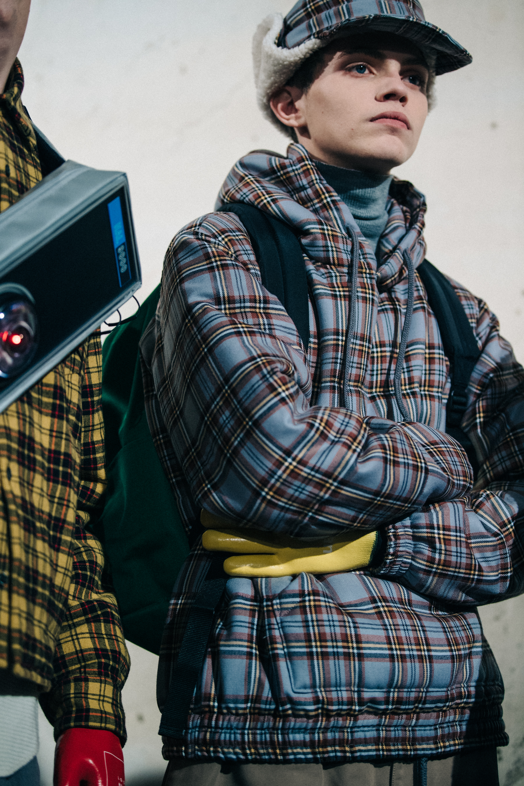 Models wearing check outfits backstage