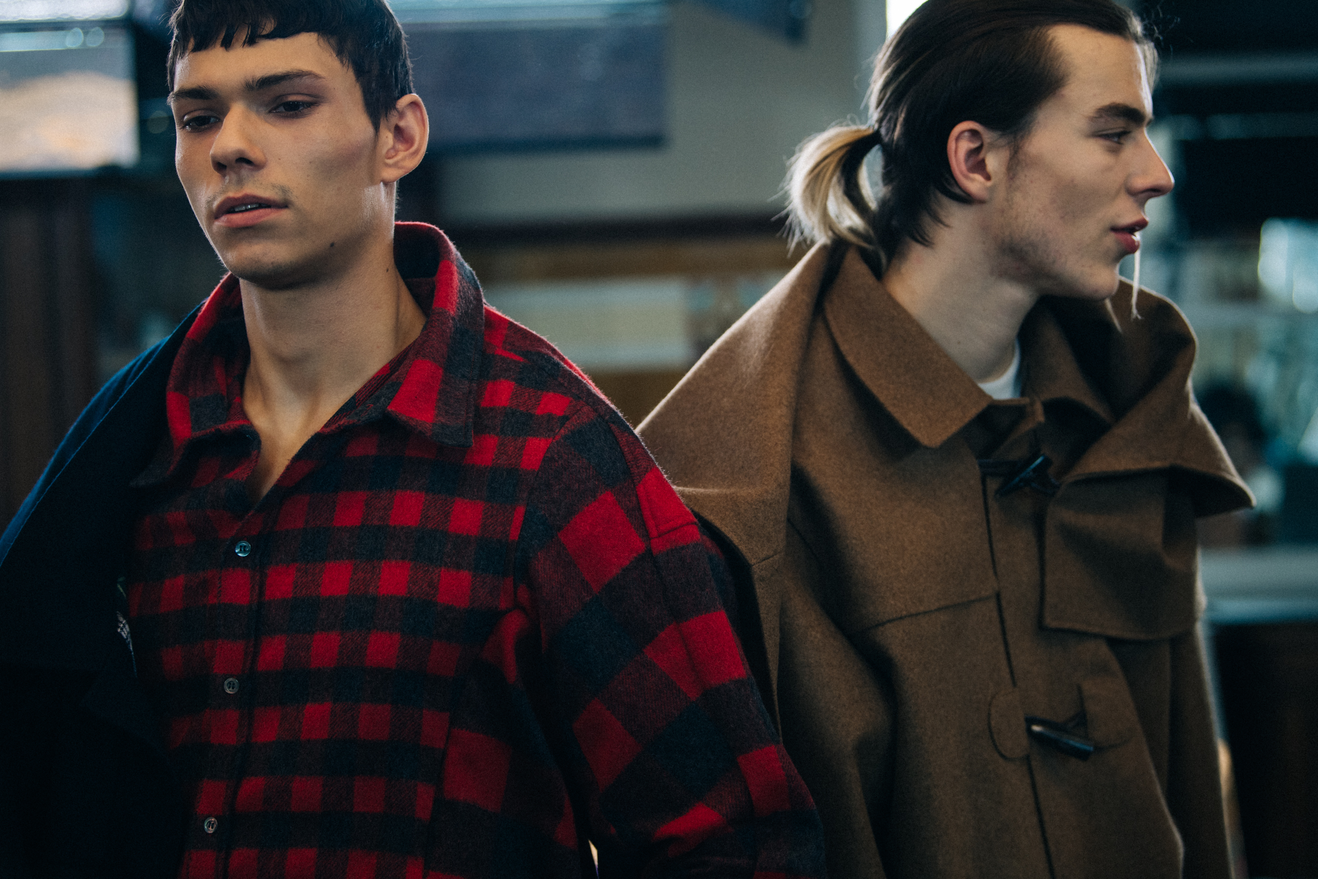 Model wearing red check shirt