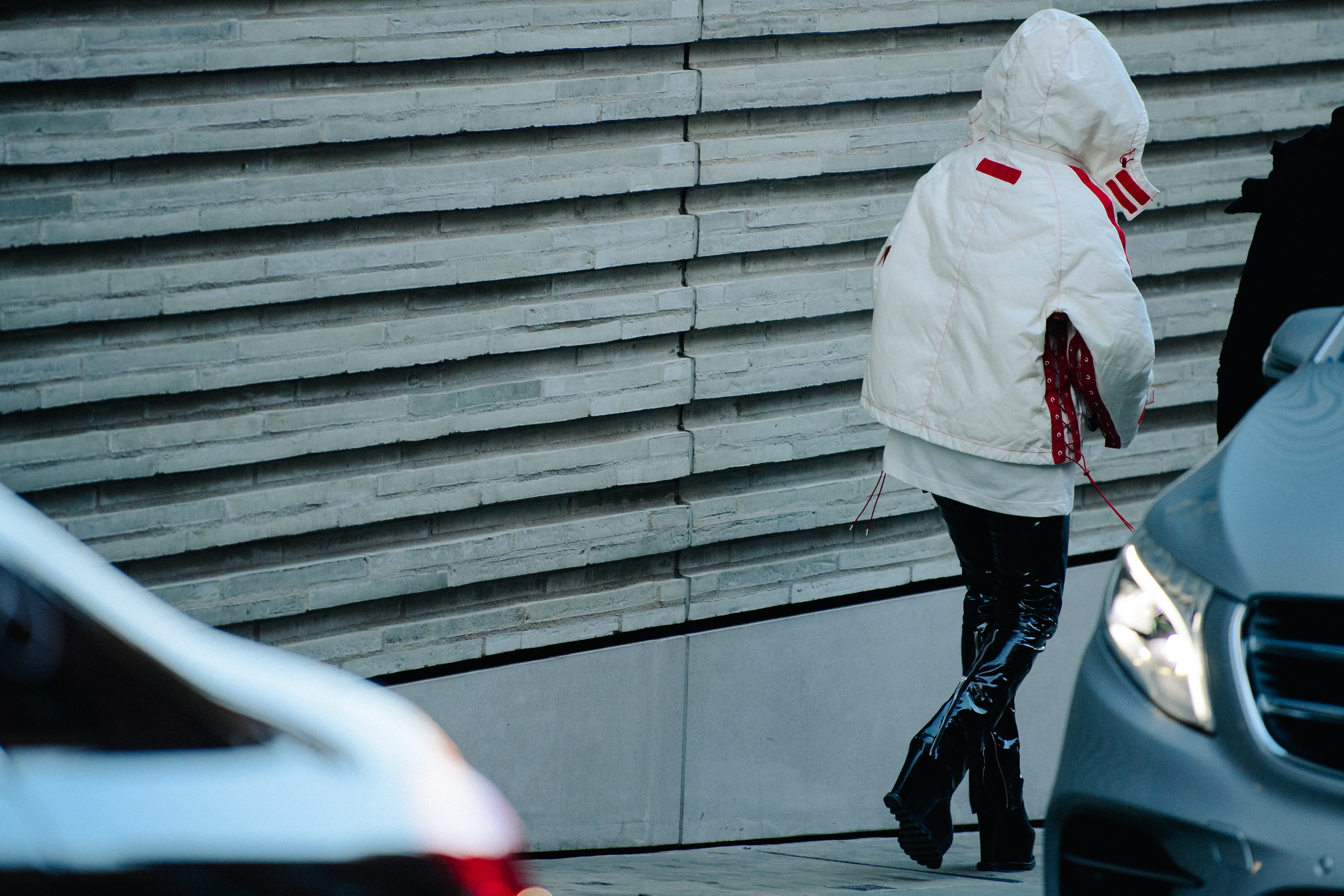 Woman wearing white coat and leather boots