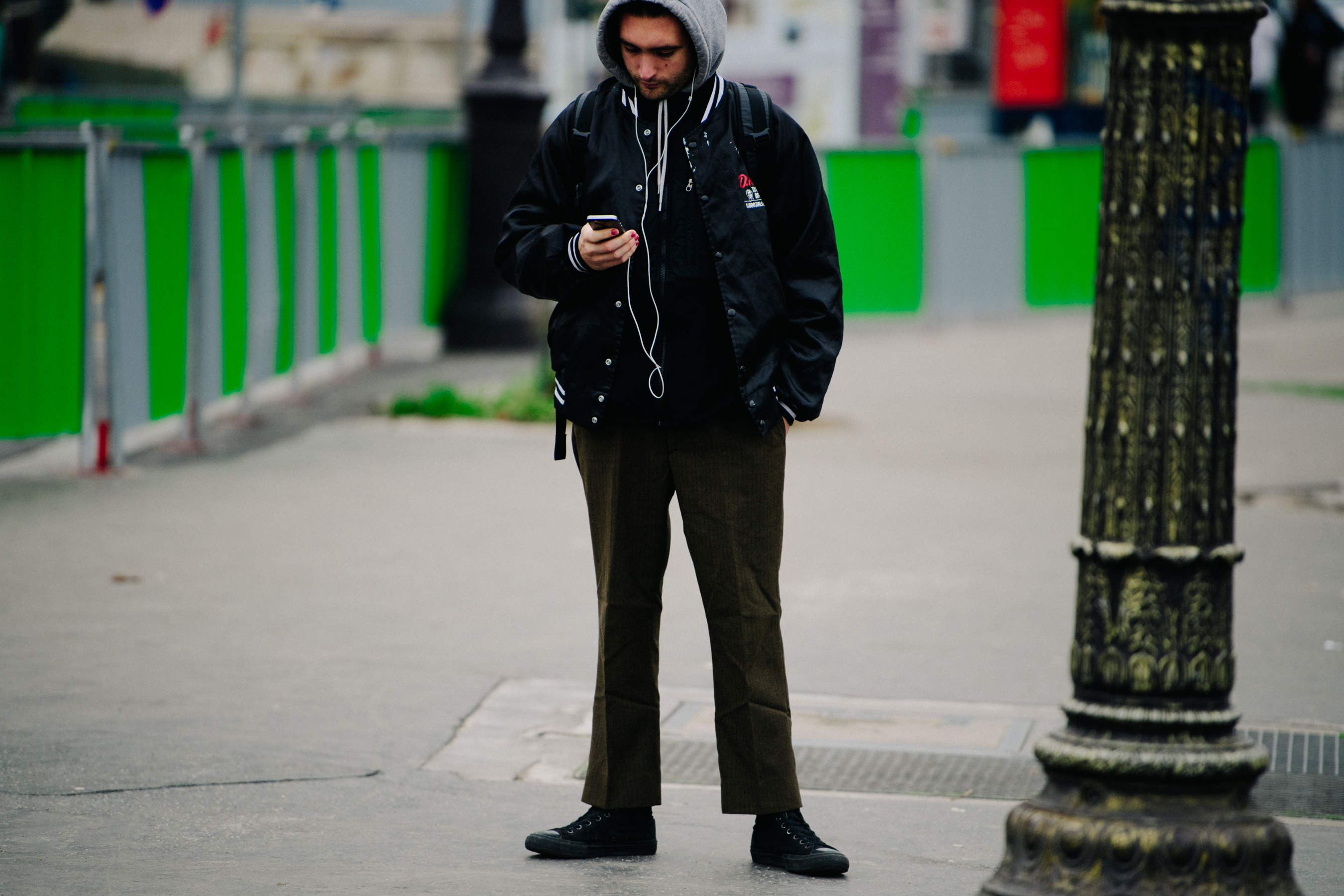 Man wearing black bomber jacket