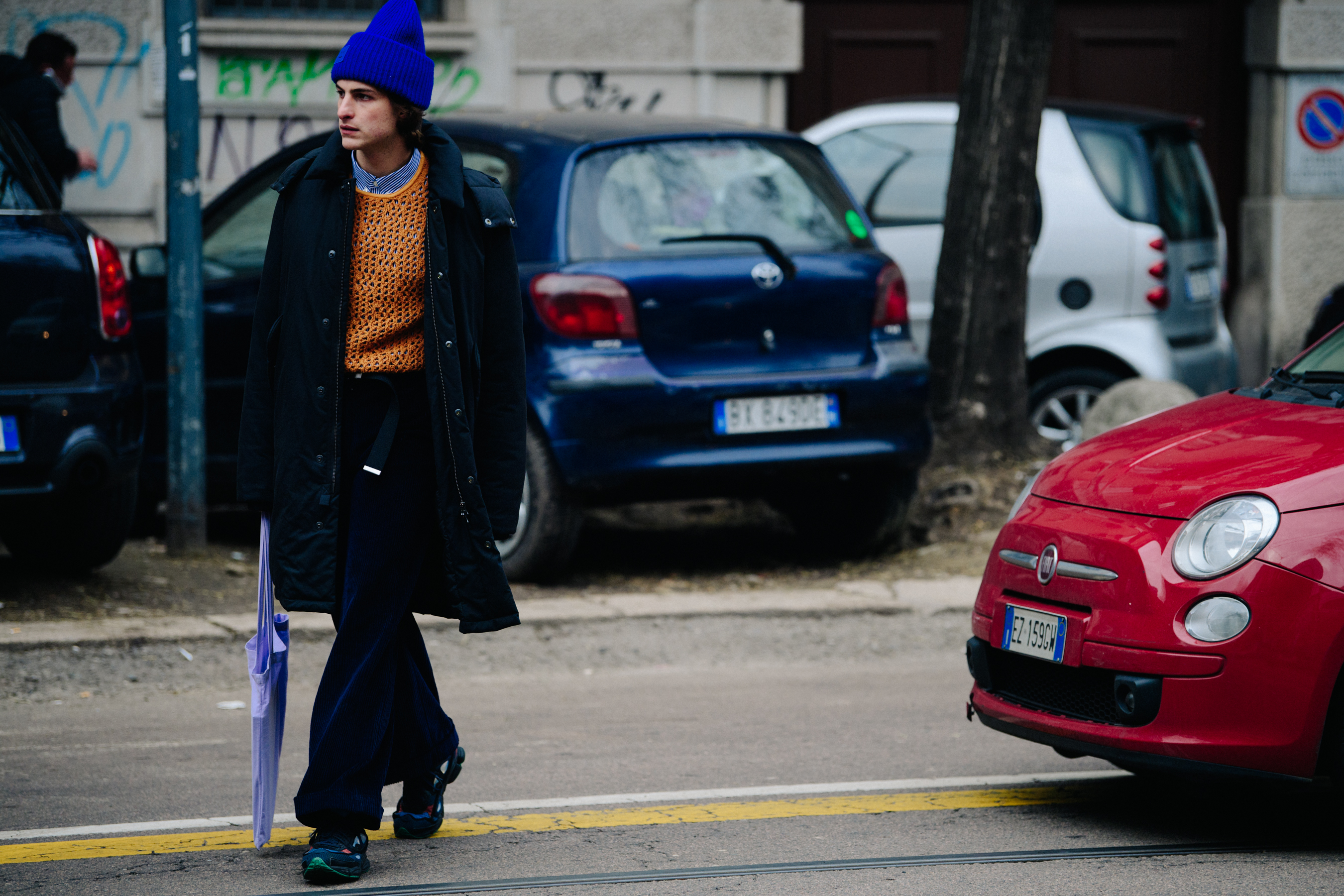 Man wearing blue Acne Studios beanie