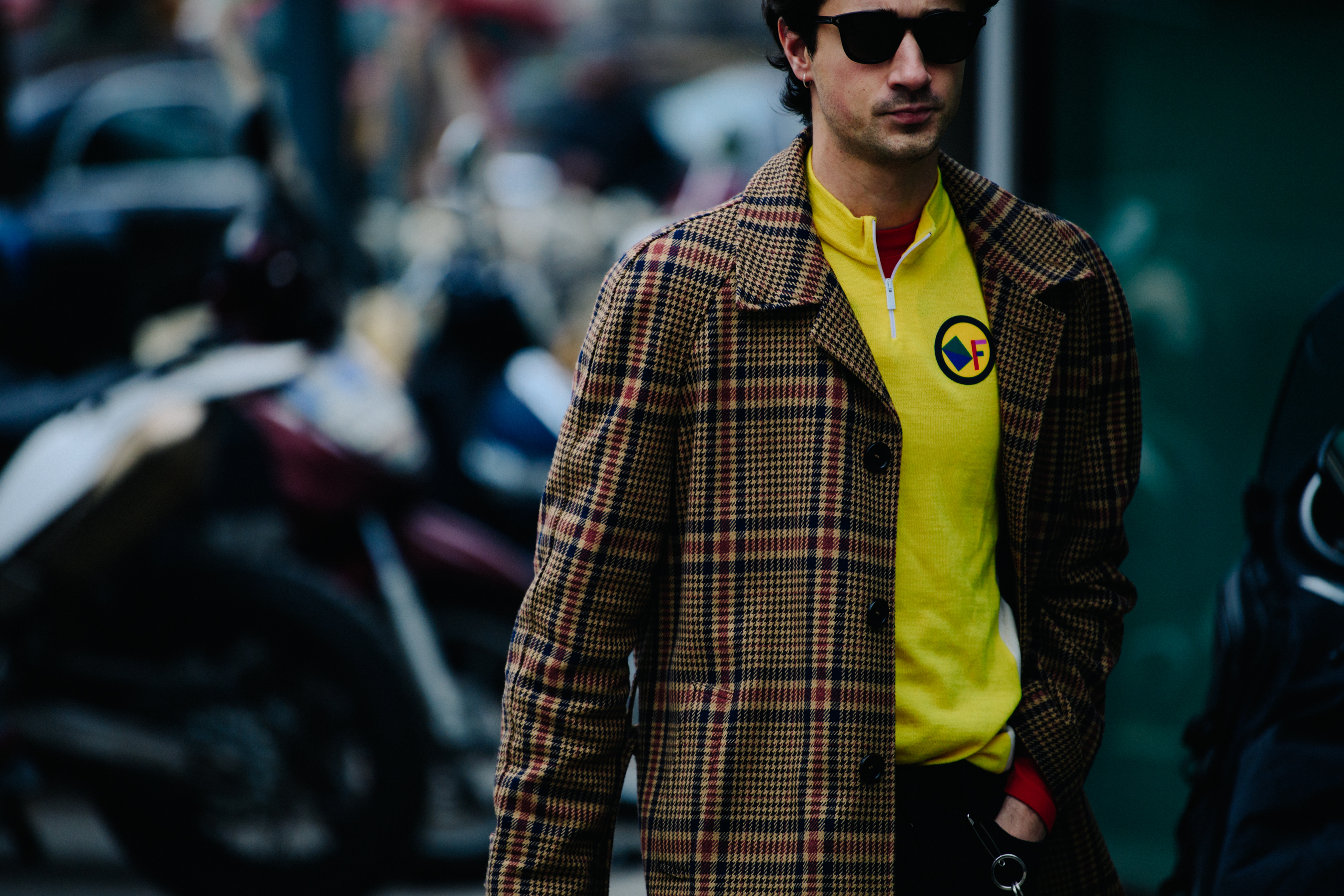 Man wearing yellow sports zip top