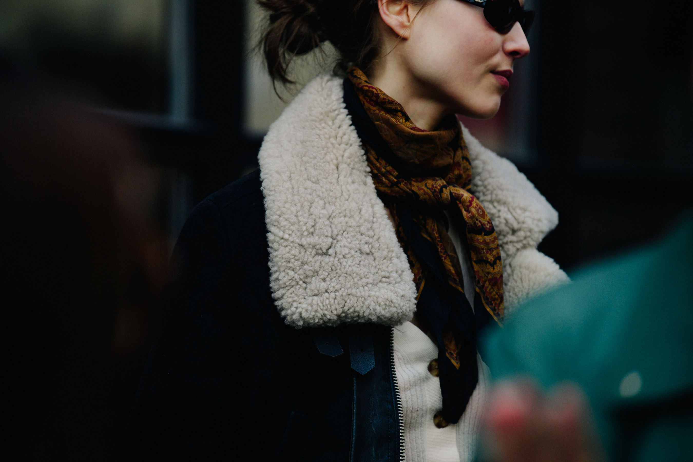 Woman wearing shearling collar jacket