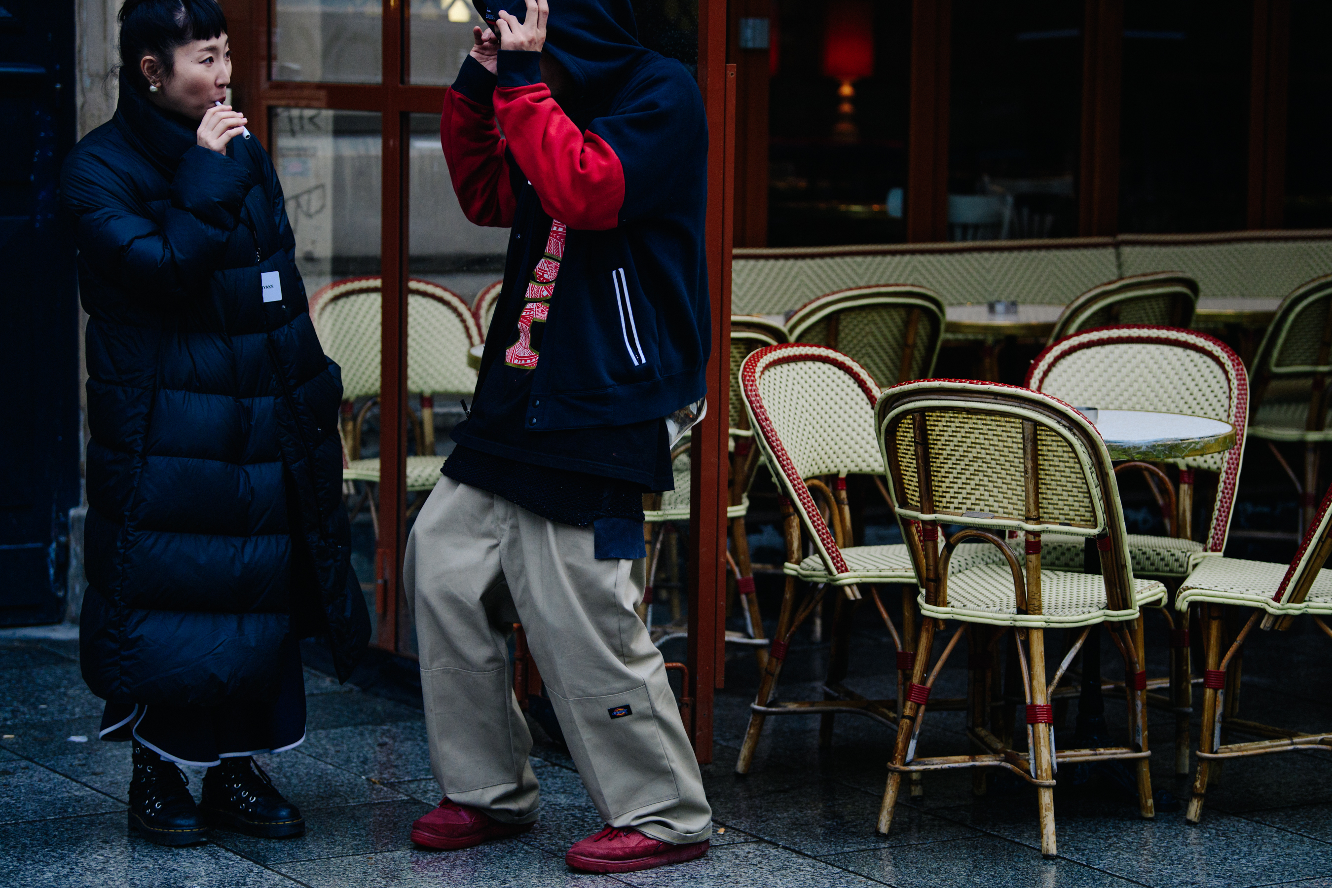 Couple smoking in dark clothing