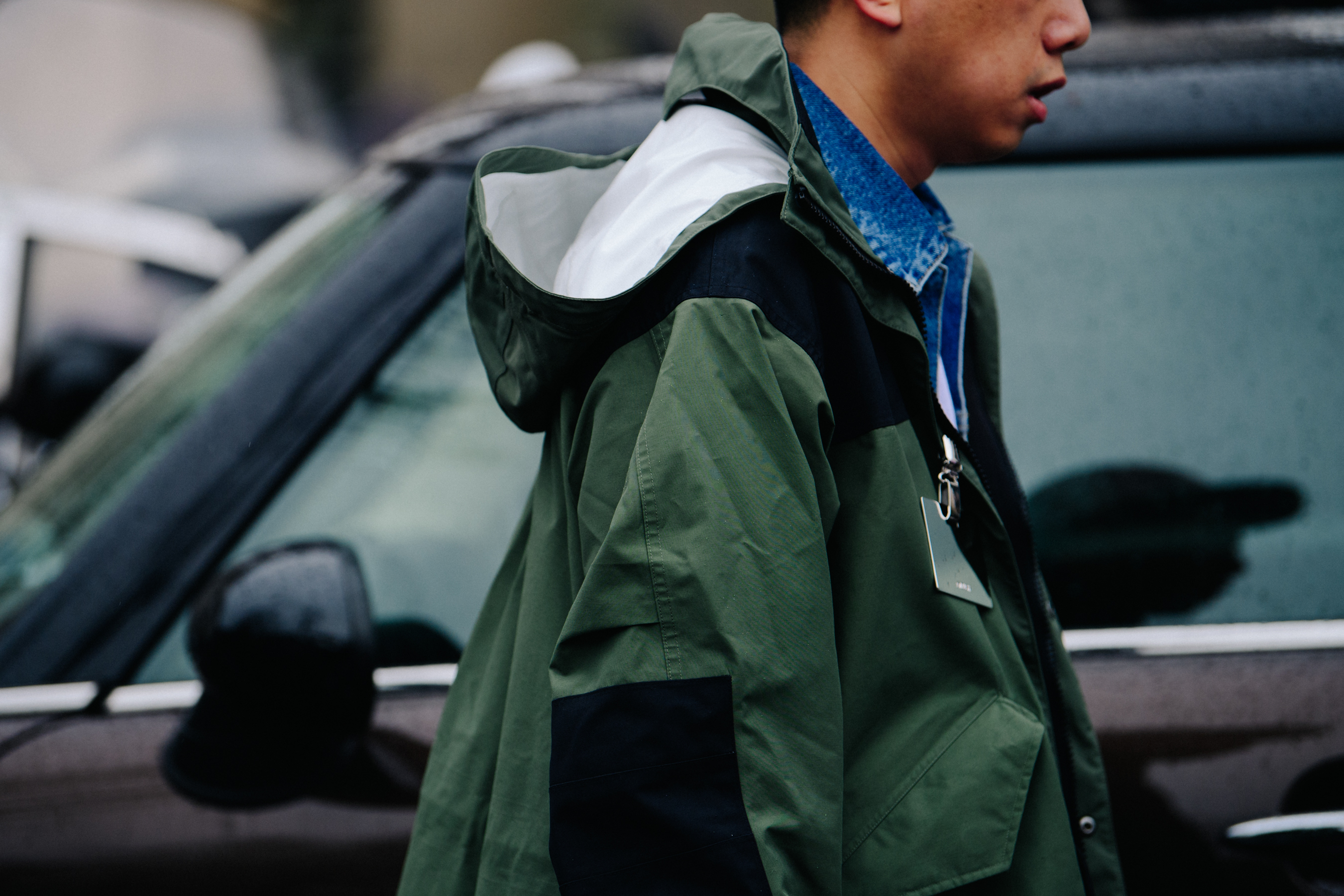 Man wearing green rain coat