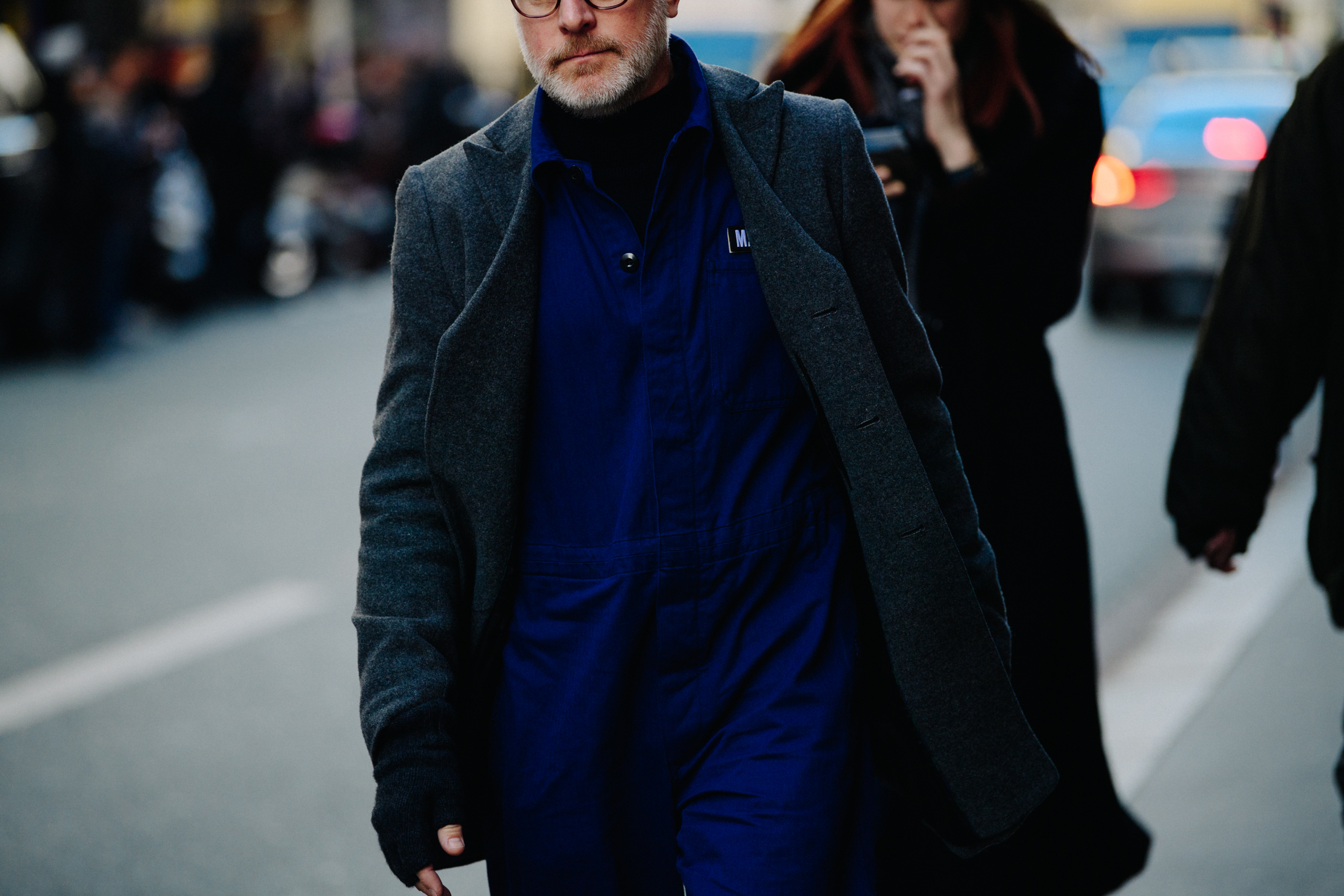 Man wearing blue overalls