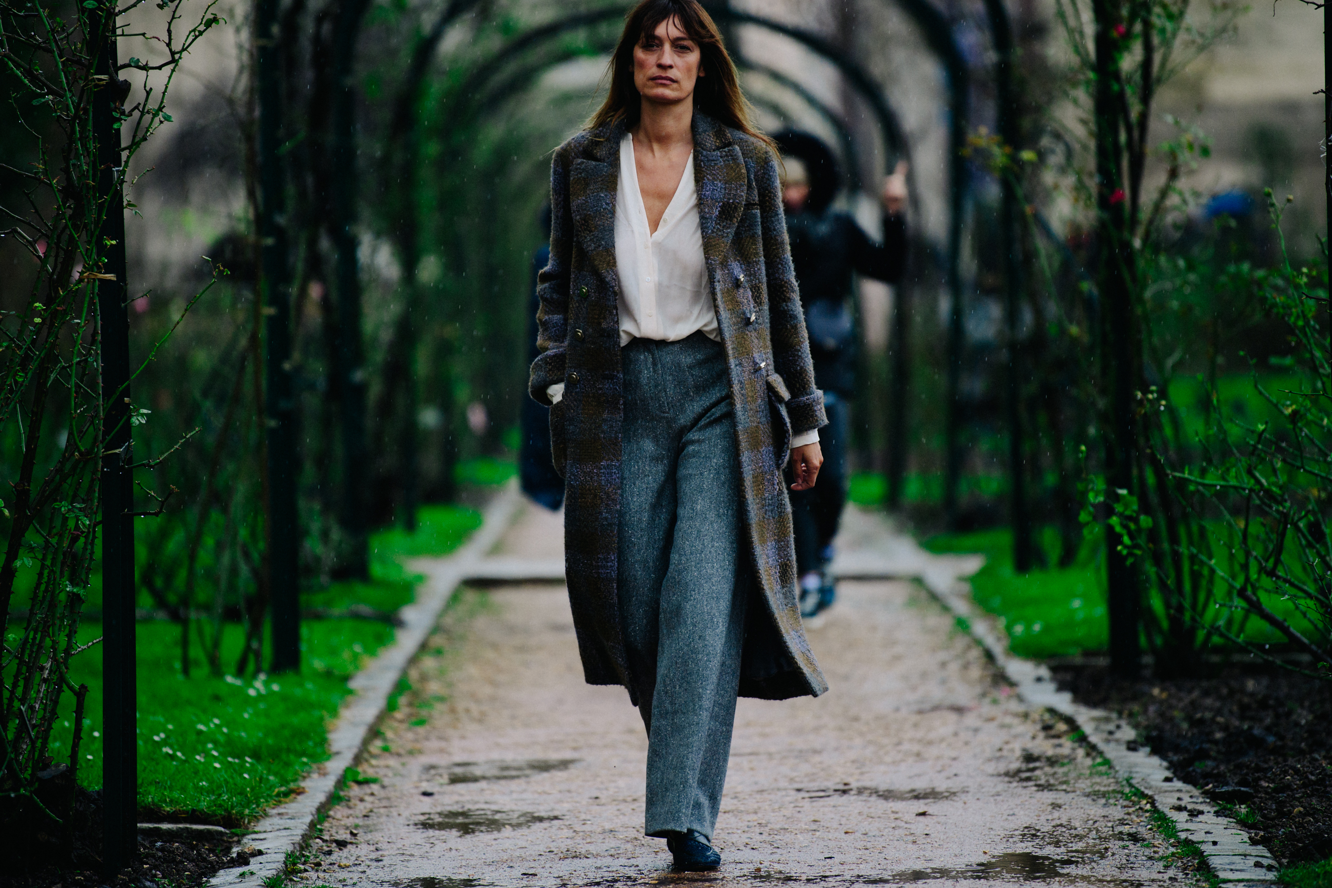 French woman wearing grey trousers