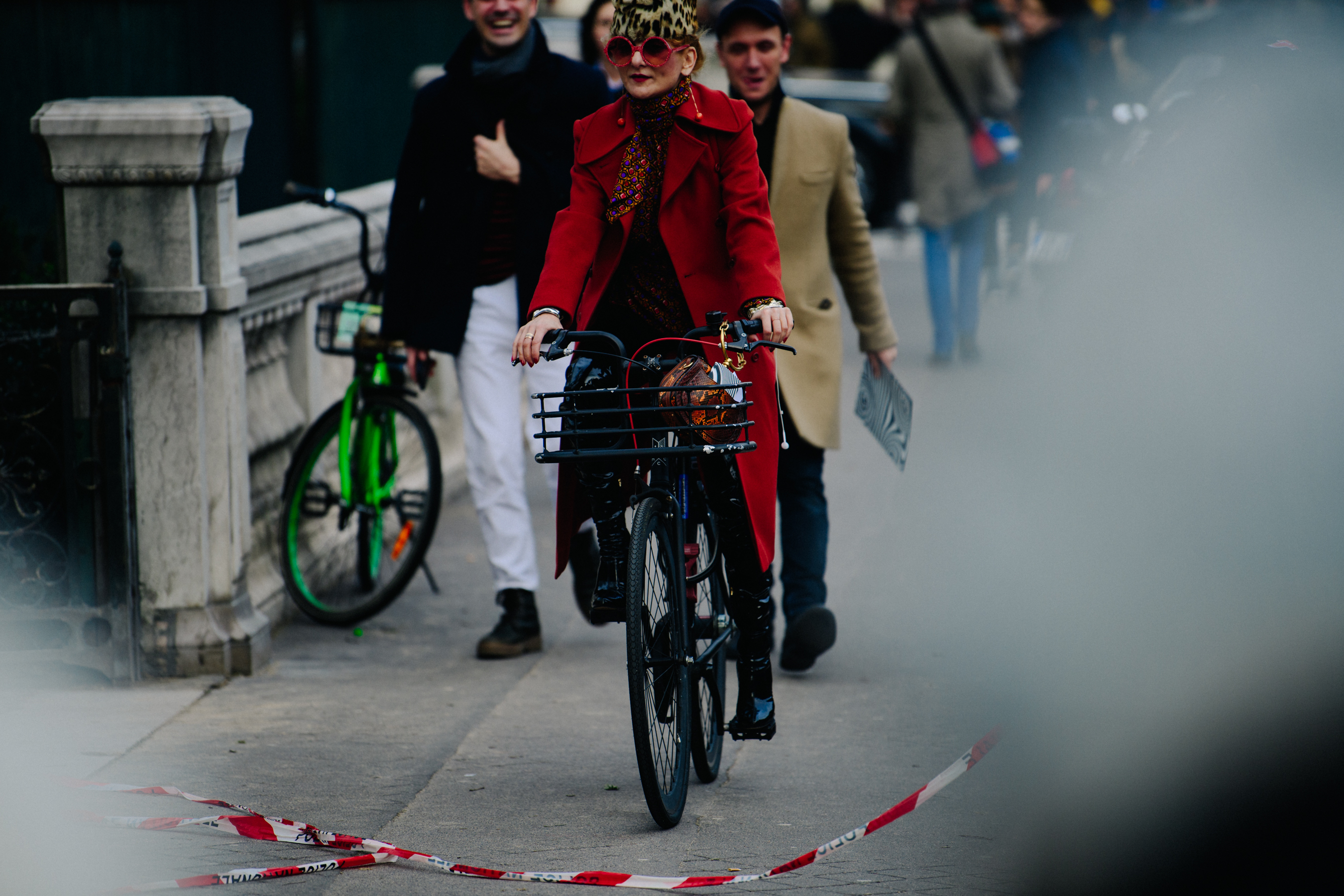 Woman riding bicycle wearing red