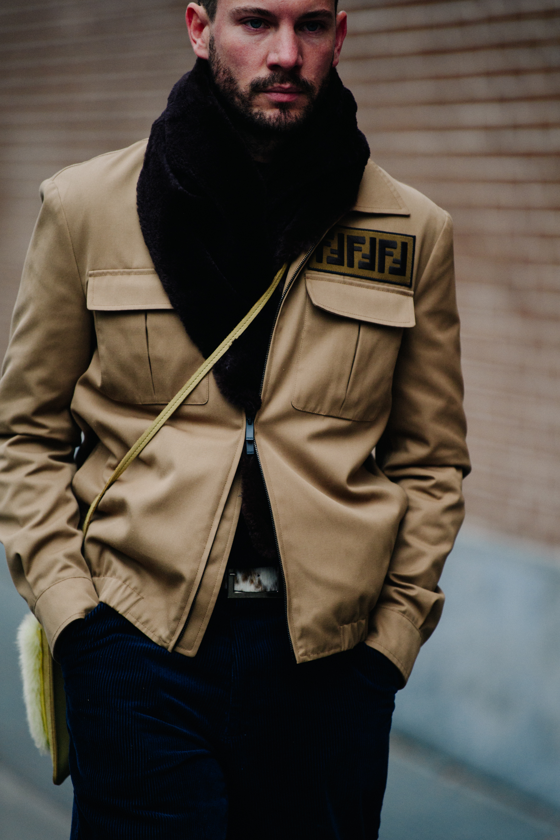 American editor wearing tan jacket